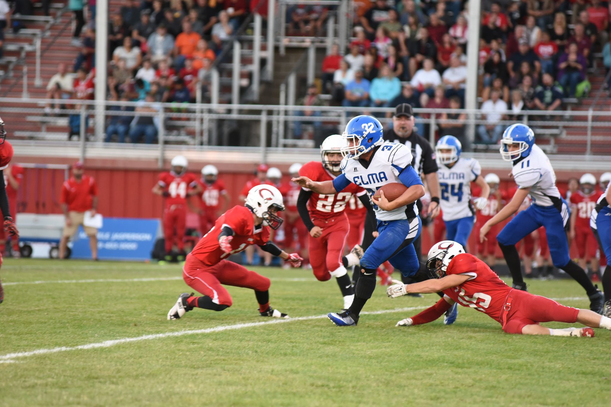 (Photo by Sue Michalak)                                Taitum Brumfield pushes down the field with a White Salmon defender grabbing at his legs during a contest at White Salmon on Friday, Sept. 9.