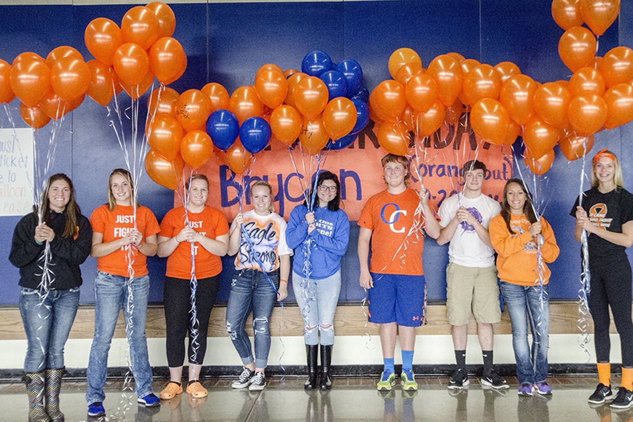 (Photo by Robert Beldin) Students from Elma High School organized a birthday memorial for classmate Brycen Rustemeyer and raised $250 for Mary Bridge Children’s Hospital in his honor. Brycen would have been 18 on Oct. 20. His schoolmates sang happy birthday and released balloons from Davis Field behind Elma High School. From leftt: Dallas Trusty, Peyton Elliott, Reanna Gibson, Kohlby Jo Saylor, Madisen Moore, Barrett Burbidge, Matt Hitchner, Tawni Heller and Brooke Sutherby.