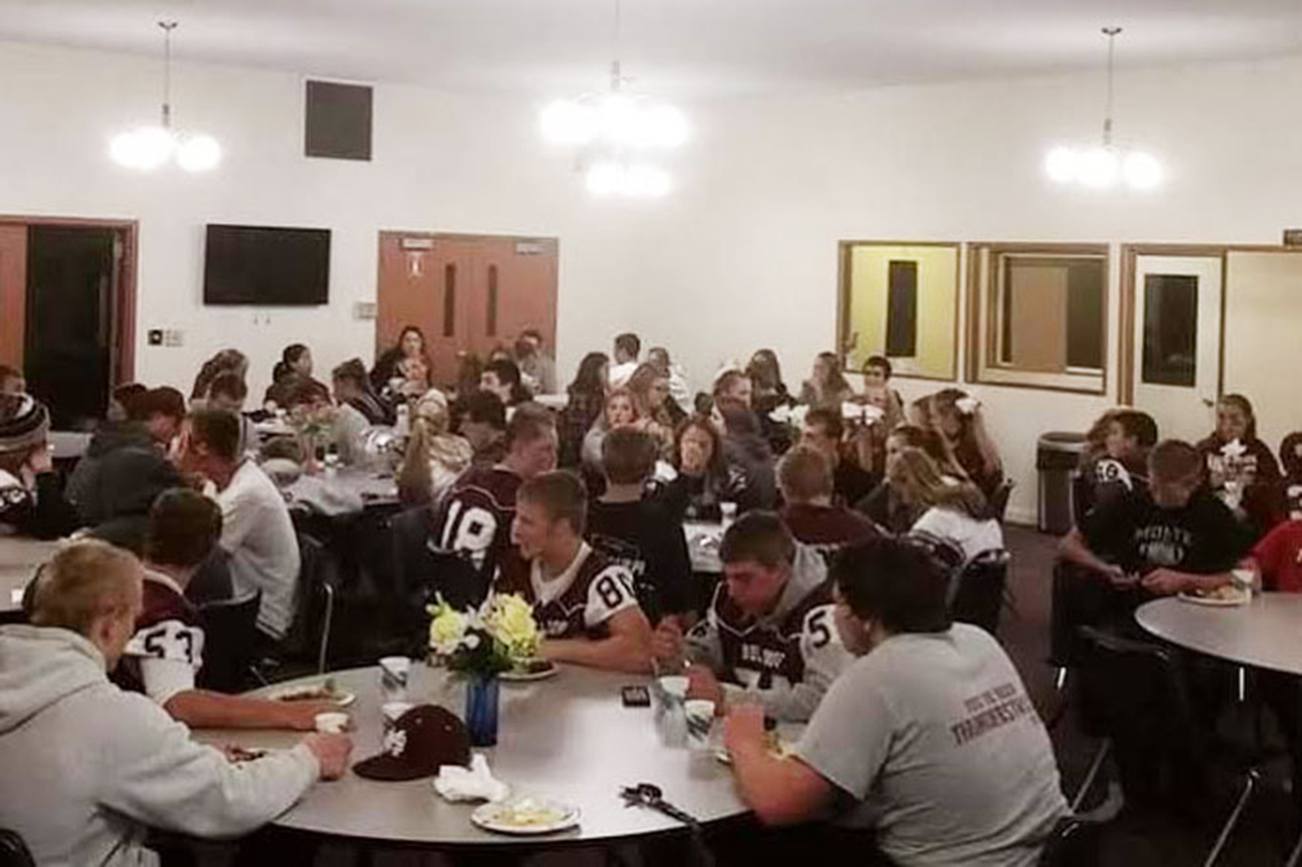 (Janet Rice photo)                                MHS students gather at the Church of God for a 5th Quarter meal. The church offers a late-night snack to football fans after varsity football home games.