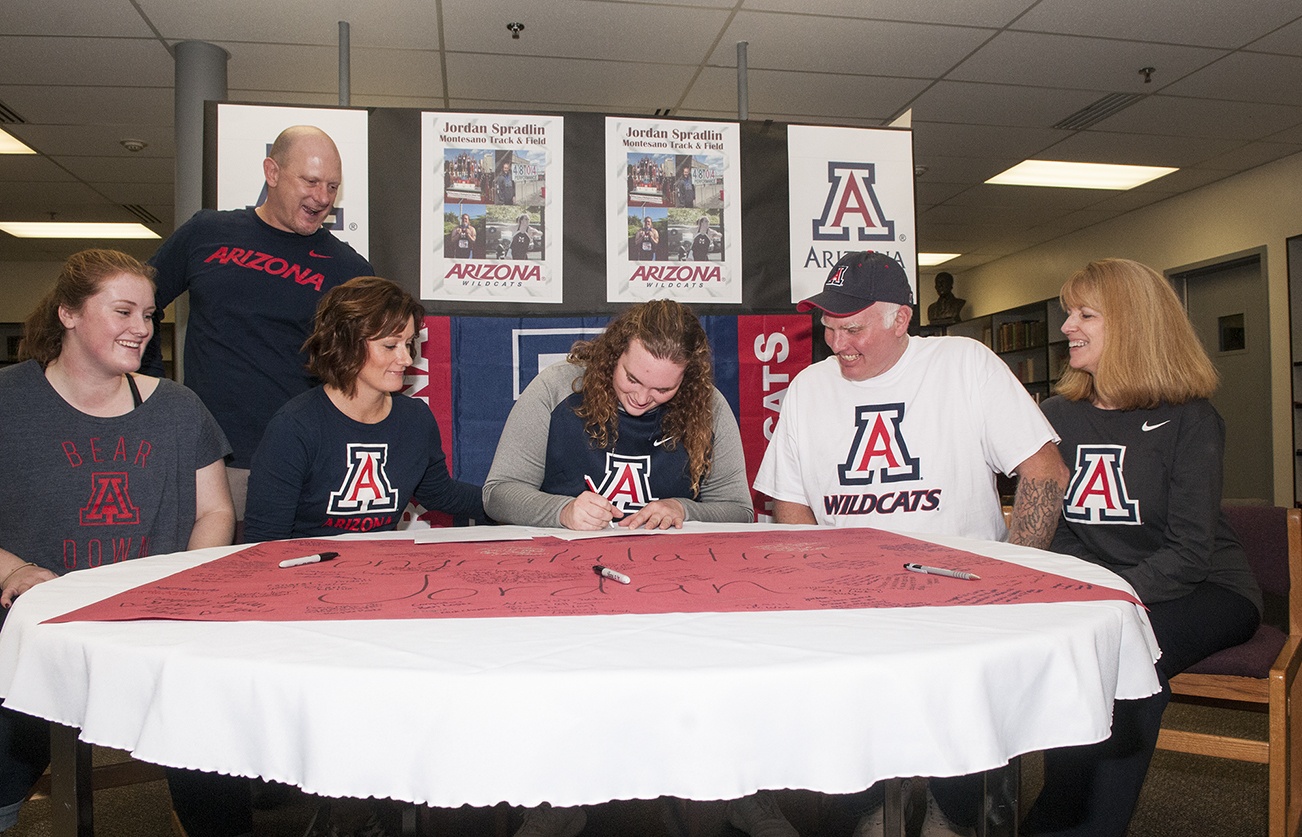 (Brendan Carl | GH Newspaper Group) Montesano’s Jordan Spradlin signs her letter of intent for the University of Arizona as she is surrounded by family members, left to right, Carly Spradlin, Alec Pugh, Dana Pugh, Brad Spradlin and Linda Spradlin.