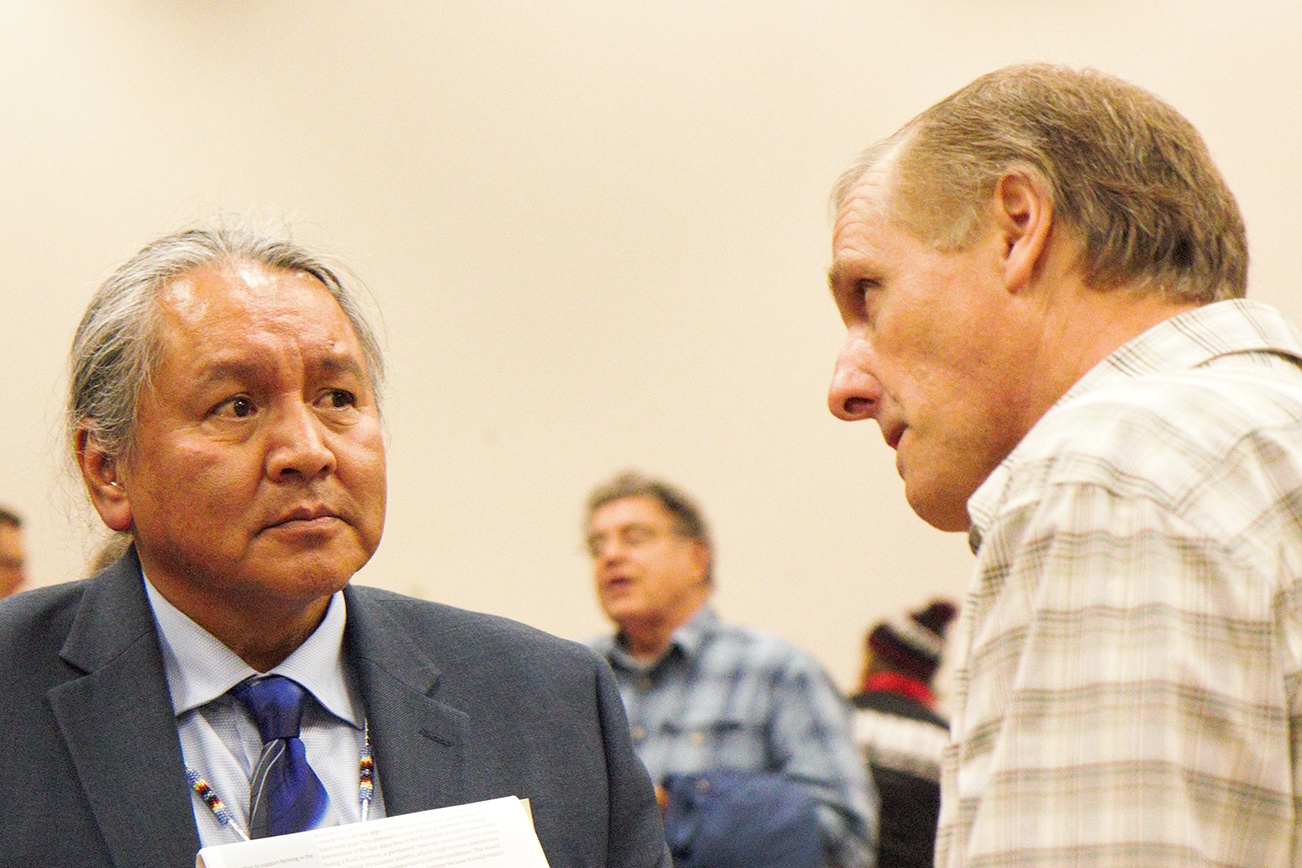 (Stephanie Morton | The Vidette) At the Chehalis Basis Strategy public hearing, held Oct. 27, in Montesano, Rodney Youckton (left) a proponent of Alternative 4 and fish habitat restoration, speaks with Al Zepp, a proponent of Alternative 1, and construction of a dam.