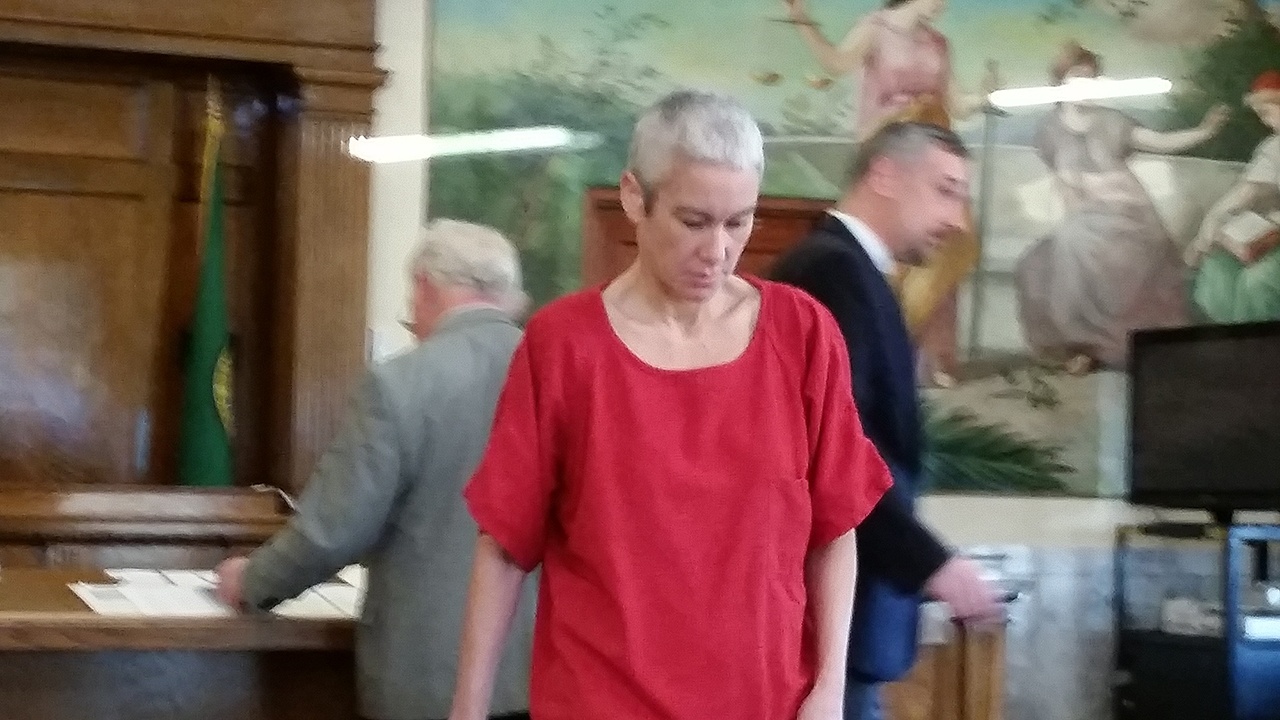 (Terri Harber | Grays Harbor Newspaper Group) Shana Soliz walks back to her seat in the courtroom after appearing in front of Judge F. Mark McCauley on Friday in Grays Harbor County Superior Court. Soliz is the suspect in a fatal stabbing of Paul Mottinger on Nov. 21. Prosecuting and defense attorneys can be seen in the background.