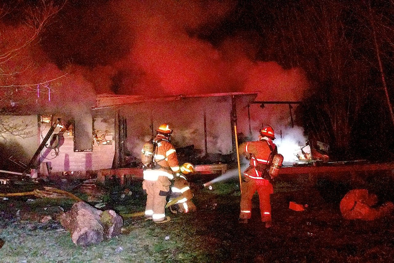 Firefighters from District 5 and the Elma Fire Department responding to reports of a residential structure fire at the end of the 200 block of Newman Middle Branch Road in Satsop arrived to find the home fully engulfed. The resident of the home and her pets were able to escape. The cause of the fire is under investigation. (Grays Harbor Fire District #5 photo)                                 Firefighters from District 5 and the Elma Fire Department responding to reports of a residential structure fire at the end of the 200 block of Newman Middle Branch Road in Satsop arrived to find the home fully engulfed. The resident of the home and her pets were able to escape. The cause of the fire is under investigation. (Grays Harbor Fire District #5 photo)