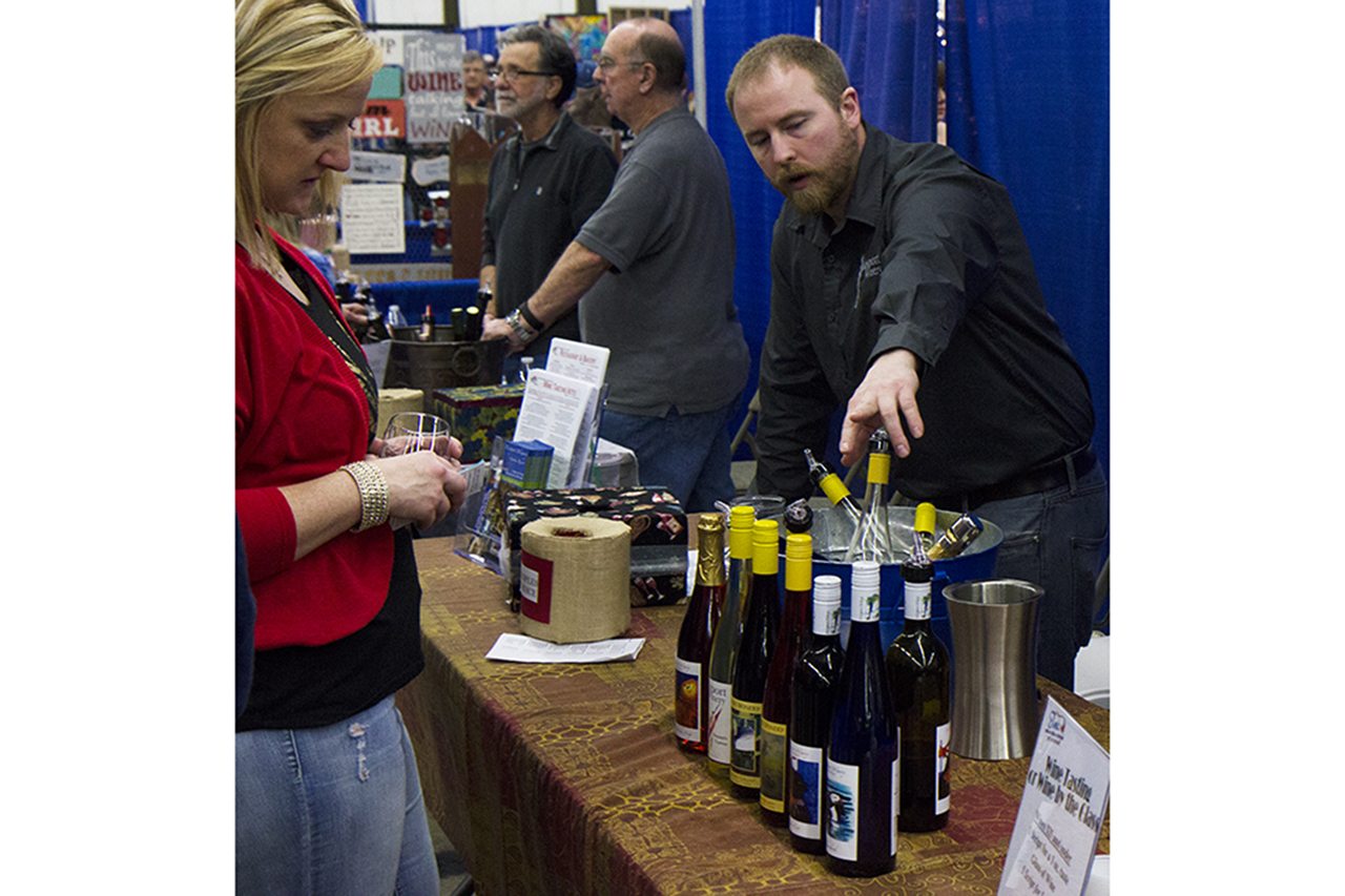 (Justin Damasiewicz | The Vidette) Dana Roberst of the Westport Winery explains the difference between the wine in his selection during the Elma Winter Wine Festival in 2016 at the Grays Harbor County Fairgrounds. The festival again will be held at the Grays Harbor Fairgrounds on Jan. 21.