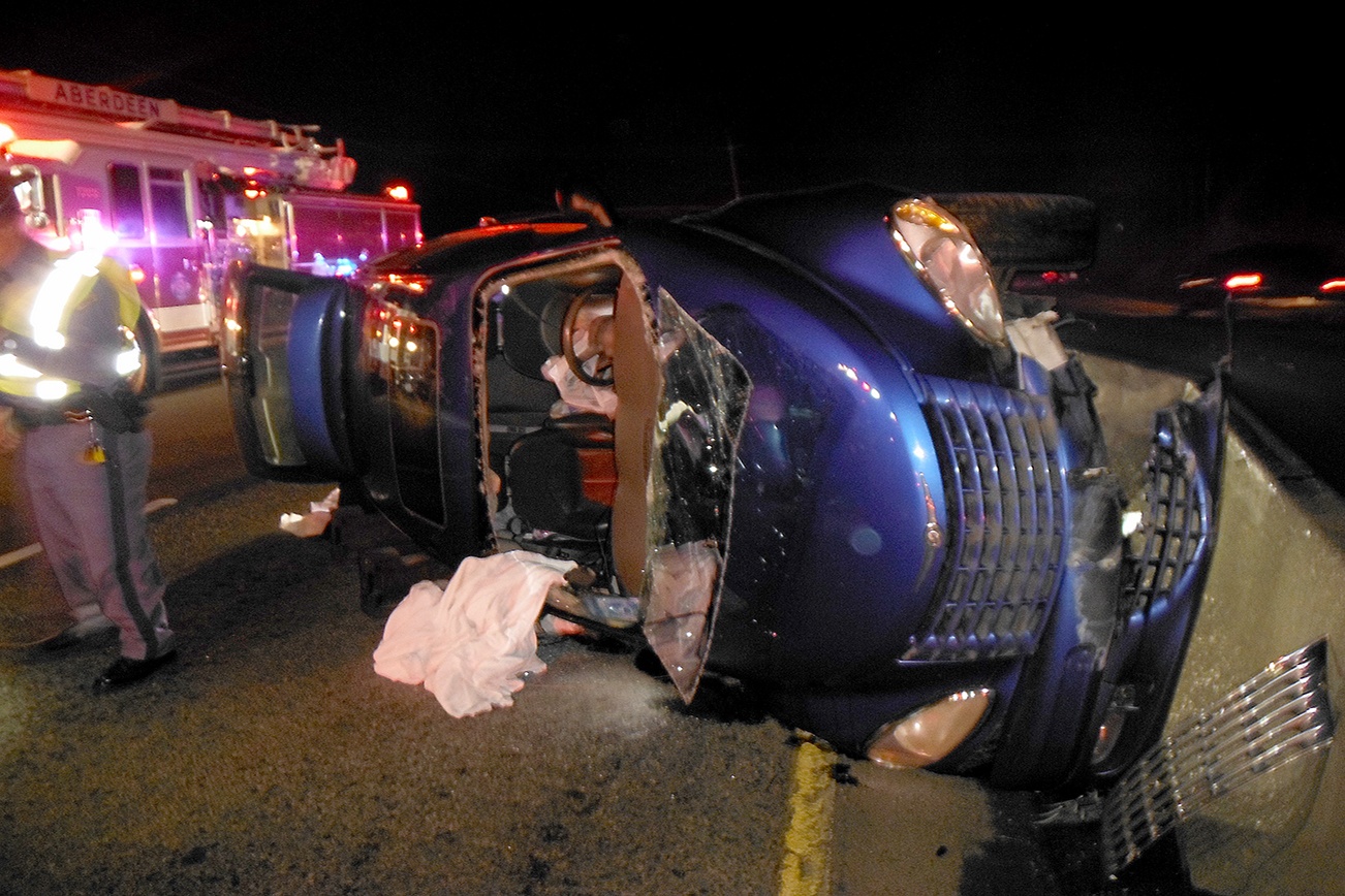 Two people escaped serious injury when their car struck the Jersey barrier on Highway 12 a mile east of Aberdeen and rolled over. The driver was trapped in the vehicle, but Aberdeen firefighters were able to extricate her in about 10 minutes. The highway was closed for about an hour after the 7:30 p.m. Sunday crash. (BATTALION CHIEF TROY PALMER ABERDEEN FIRE DEPARTMENT)