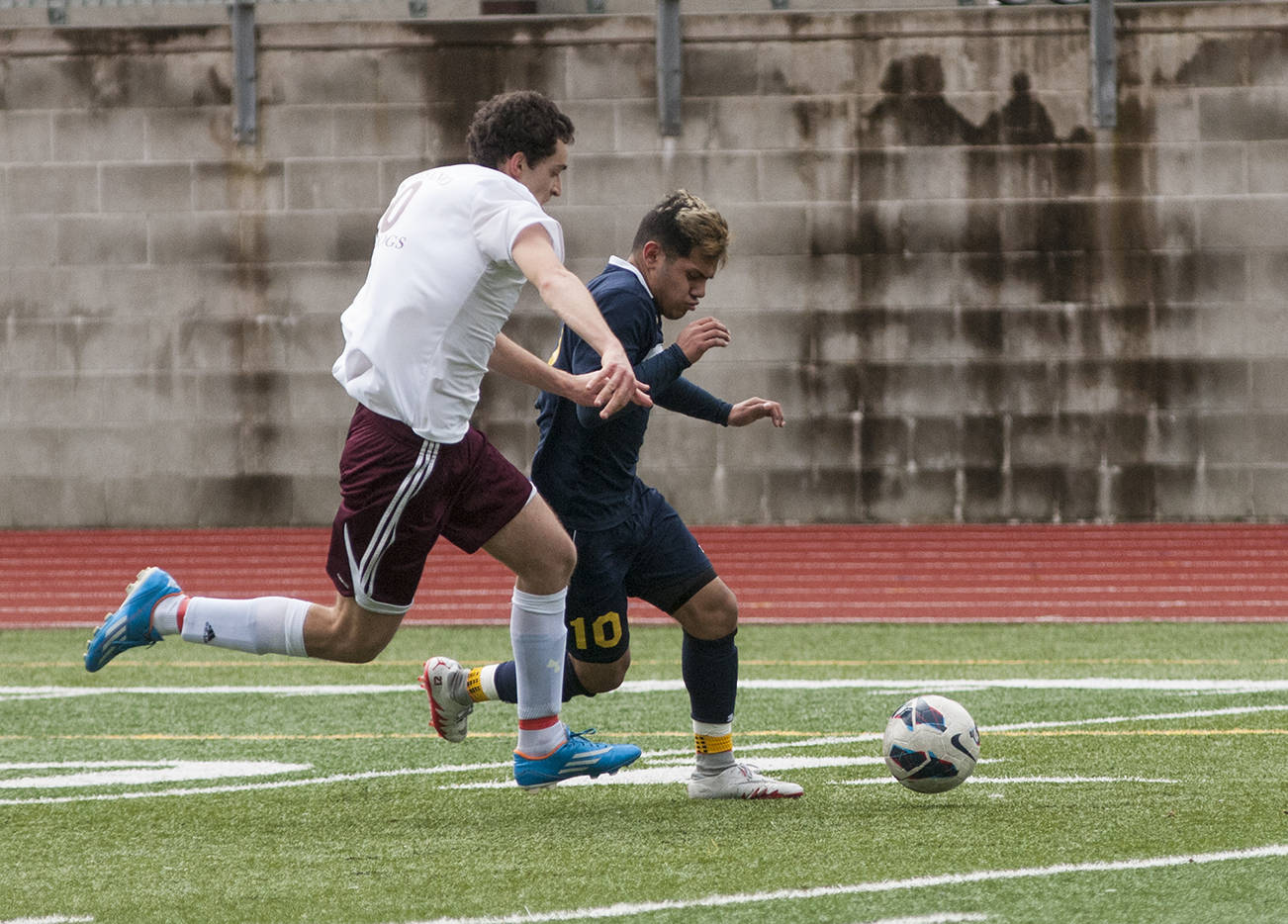 (Brendan Carl | The Daily World) Aberdeen’s Miguel Torres tries to race past Montesano’s Riccardo Marangon during a non-league soccer match at Jack Rottle Field on Saturday. Torres finished with a hat trick against the Bulldogs in a 4-0 Aberdeen victory.