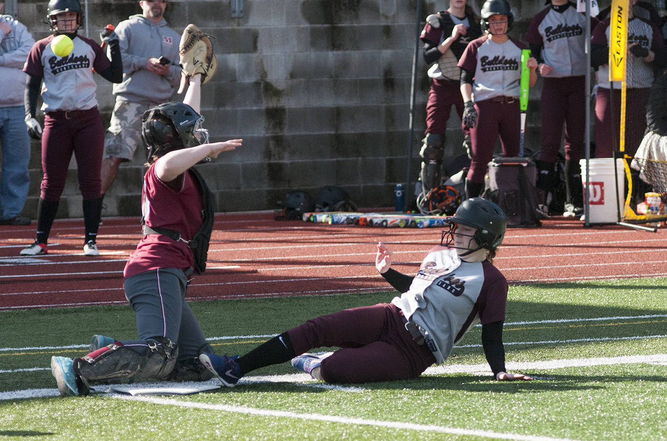 (Brendan Carl | Grays Harbor Newspaper Group) Montesano’s Lexi Lovell slides home to score the Bulldogs second run of the game against Hoquiam on Thursday. The Bulldogs defeated the Grizzlies 6-5.