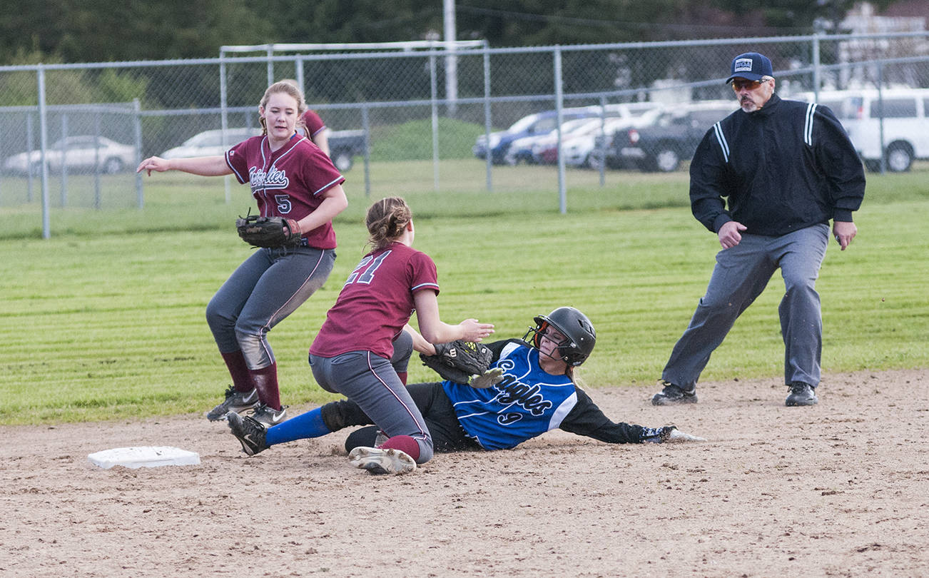 (Brendan Carl | Grays Harbor Newspaper Group) Elma’s Kassedy Olson slides into second base just ahead of the tag by Hoquiam’s Maya Jump.