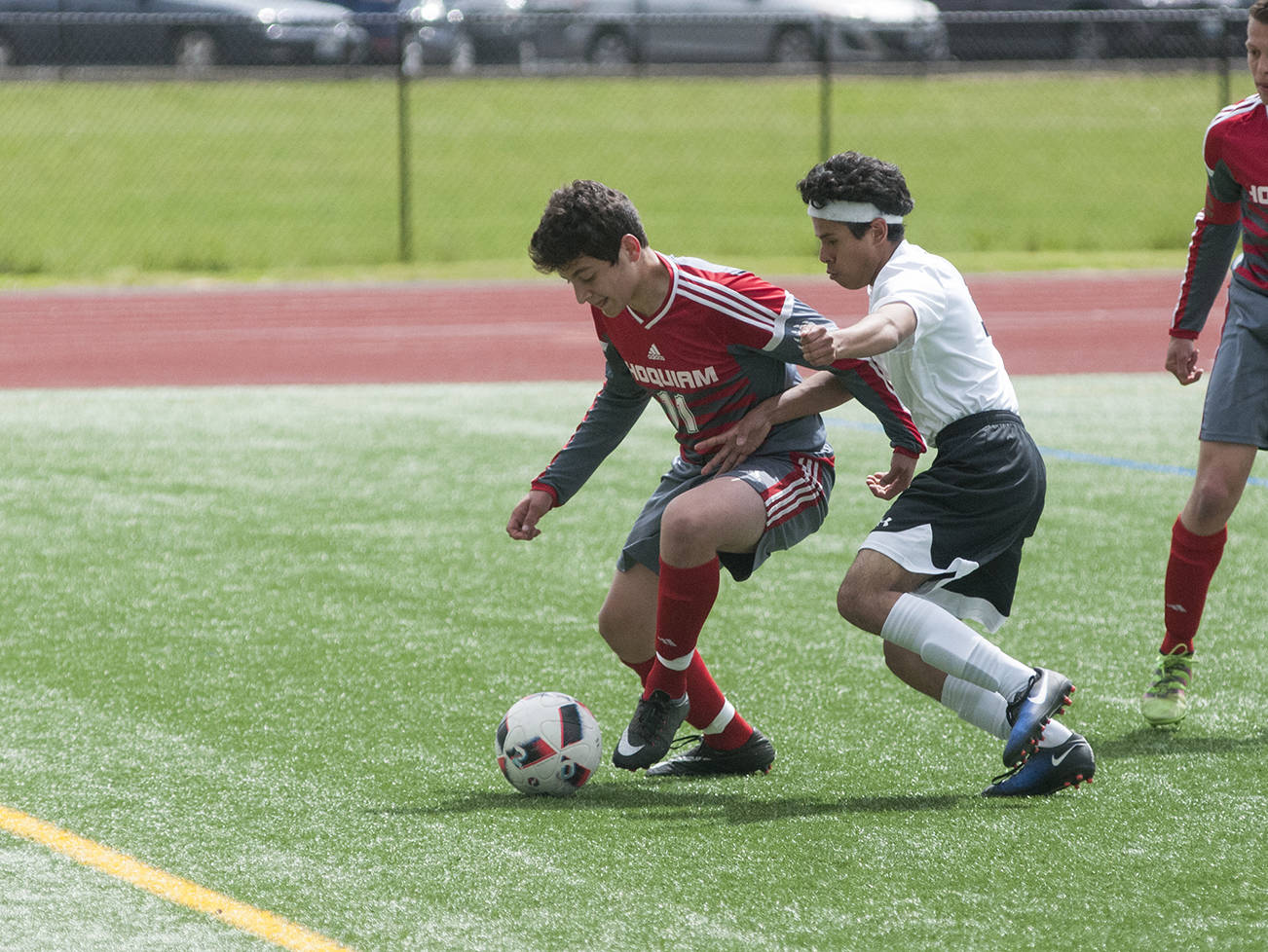 (Brendan Carl | Grays Harbor Newspaper Group) Hoquiam’s Andy Garcia battles with Toledo-Winlock United’s Santos Balbuena during the district title game on Saturday.
