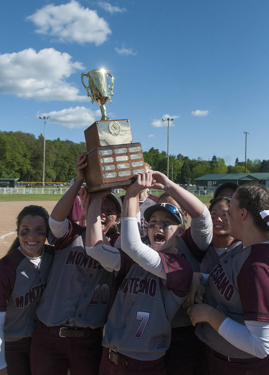 (Brendan Carl | Grays Harbor Newspaper Group) Montesano’s Cheyann Bartlett (7) and Josie Toyra hoist the district title trophy after the Bulldogs defeated La Center 5-0 on Saturday.
