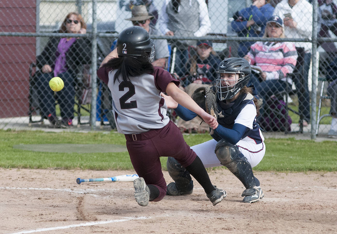 (Brendan Carl | Grays Harbor Newspaper Group) PWV’s Grace Hodel waits for the ball as Montesano’s Linghong Schoch slides home on Monday.