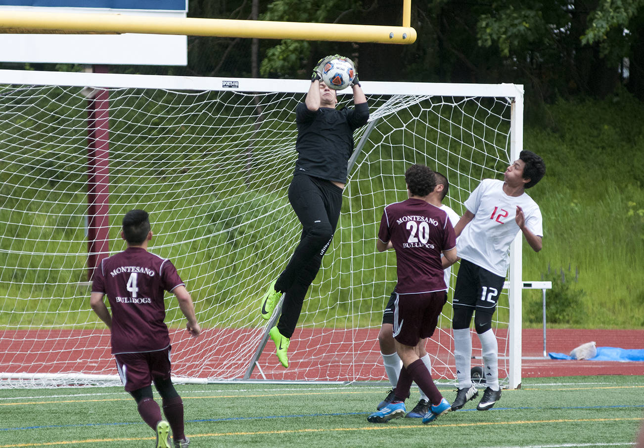 (Brendan Carl | Grays Harbor Newspaper Group) Montesano goalkeeper Waymn Thoemmes leaps to make a save against White Salmon on Saturday.