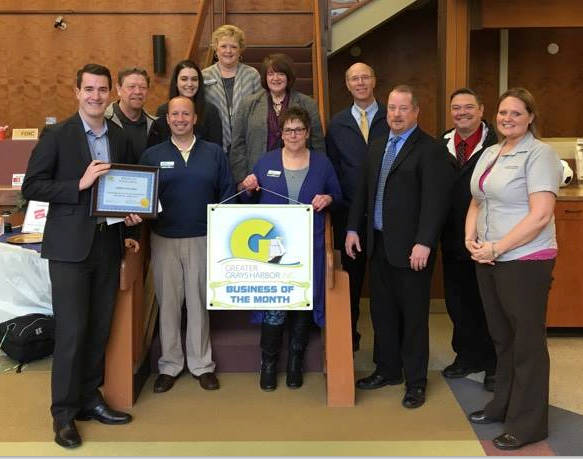 (Courtesy photo) Employees of Timberland Bank and Greater Grays Harbor Inc. ambassadors pose for a photo. Timberland Bank was named GGHI Business of the Month of April.