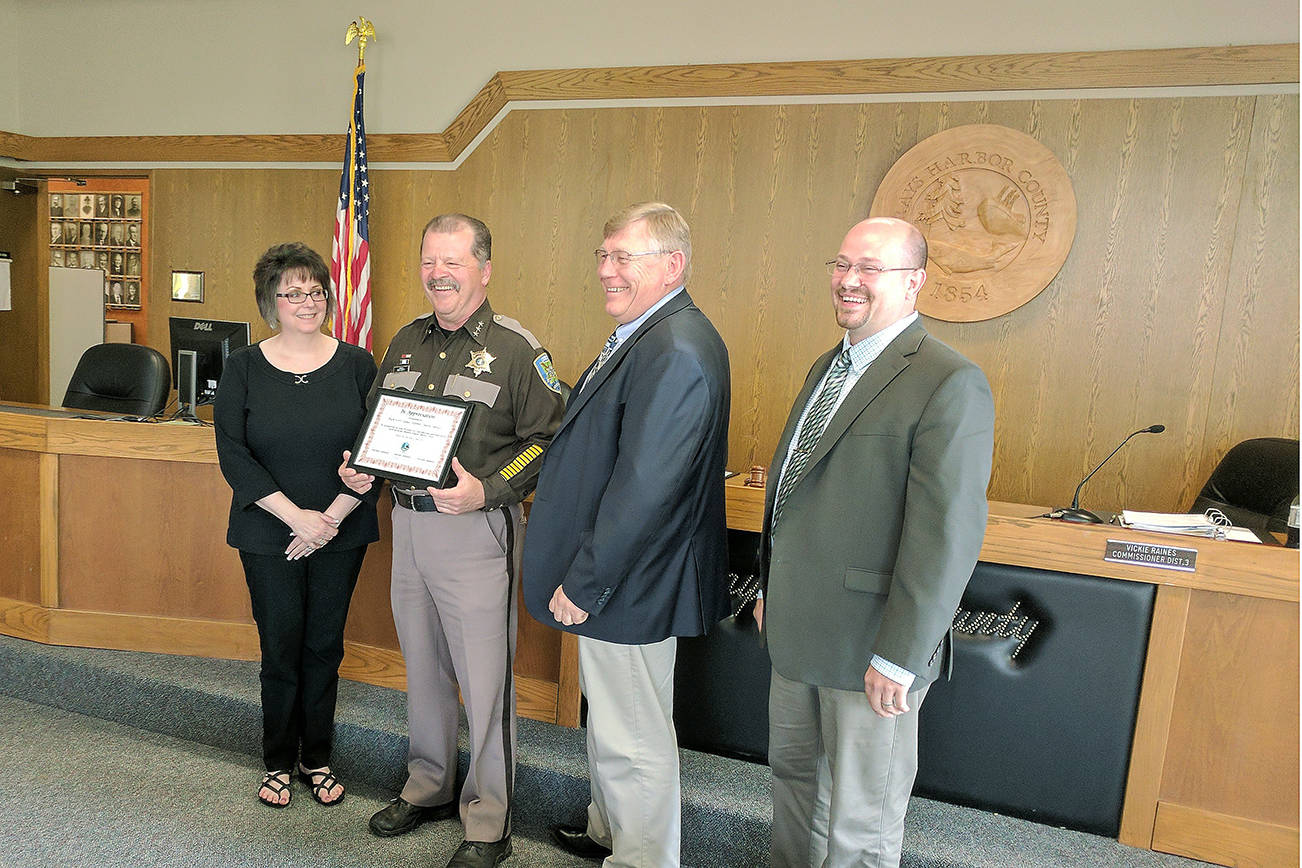 (Corey Morris | Vidette Editor) Grays Harbor County Commissioner Vickie Raines, Sheriff Rick Scott, and commissioners Randy Ross and Wes Cormier pose for a photo after Scott was recognized for 40 years of service to Grays Harbor County.