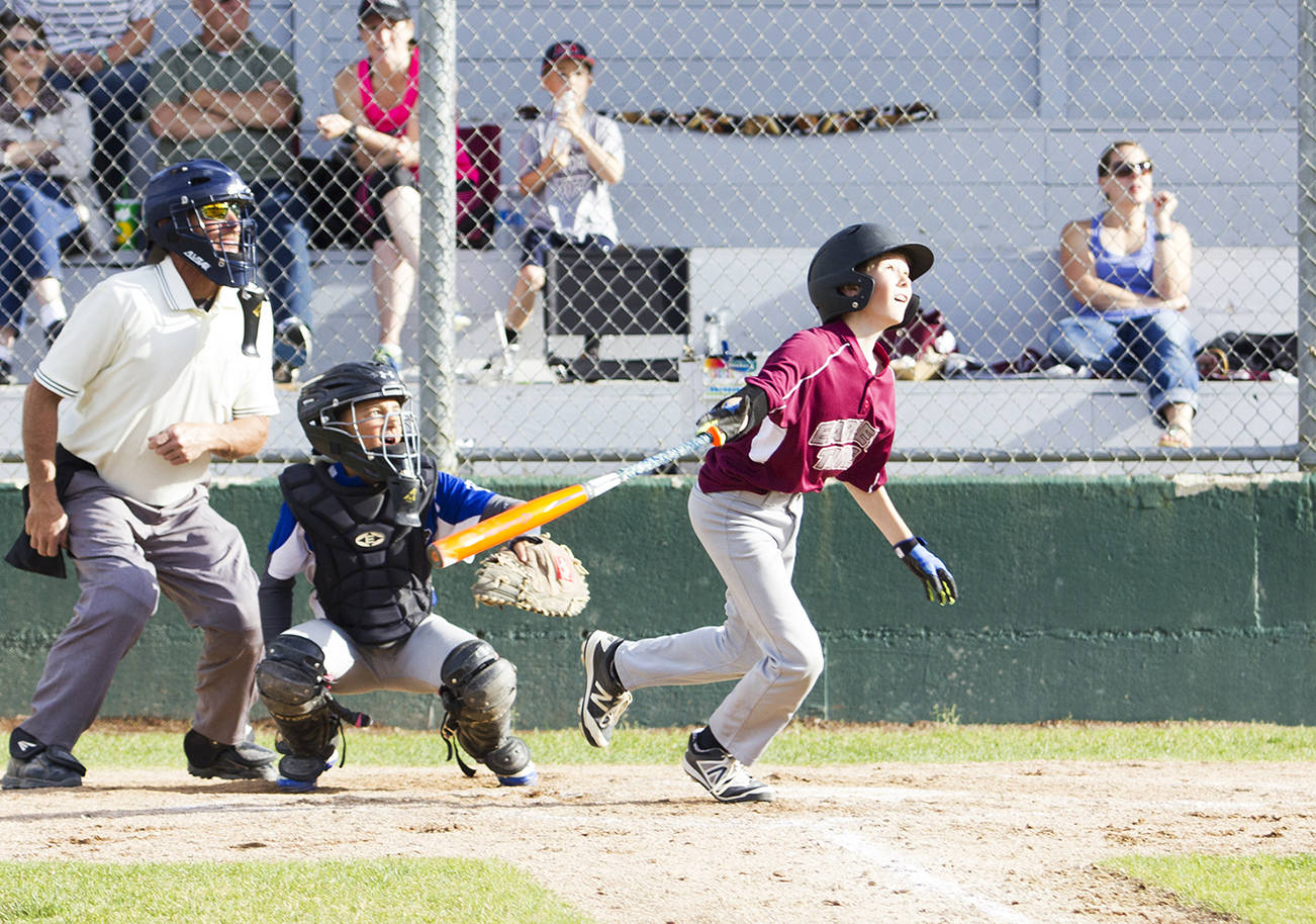 (Photo by Justin Damasiewicz) Earley Tire’s Bode Poler watches his hit sail over the fence for a home run during a Montesano Little League game against Whitney’s at Nelson Field on June 6. Poler was selected to the 11-12 year-old district all star team.