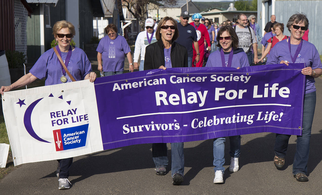 (Travis Rains | The Vidette) Cancer survivors open Relay for Life at the Grays Harbor County Fairgrounds June 2 with the survivor’s lap.