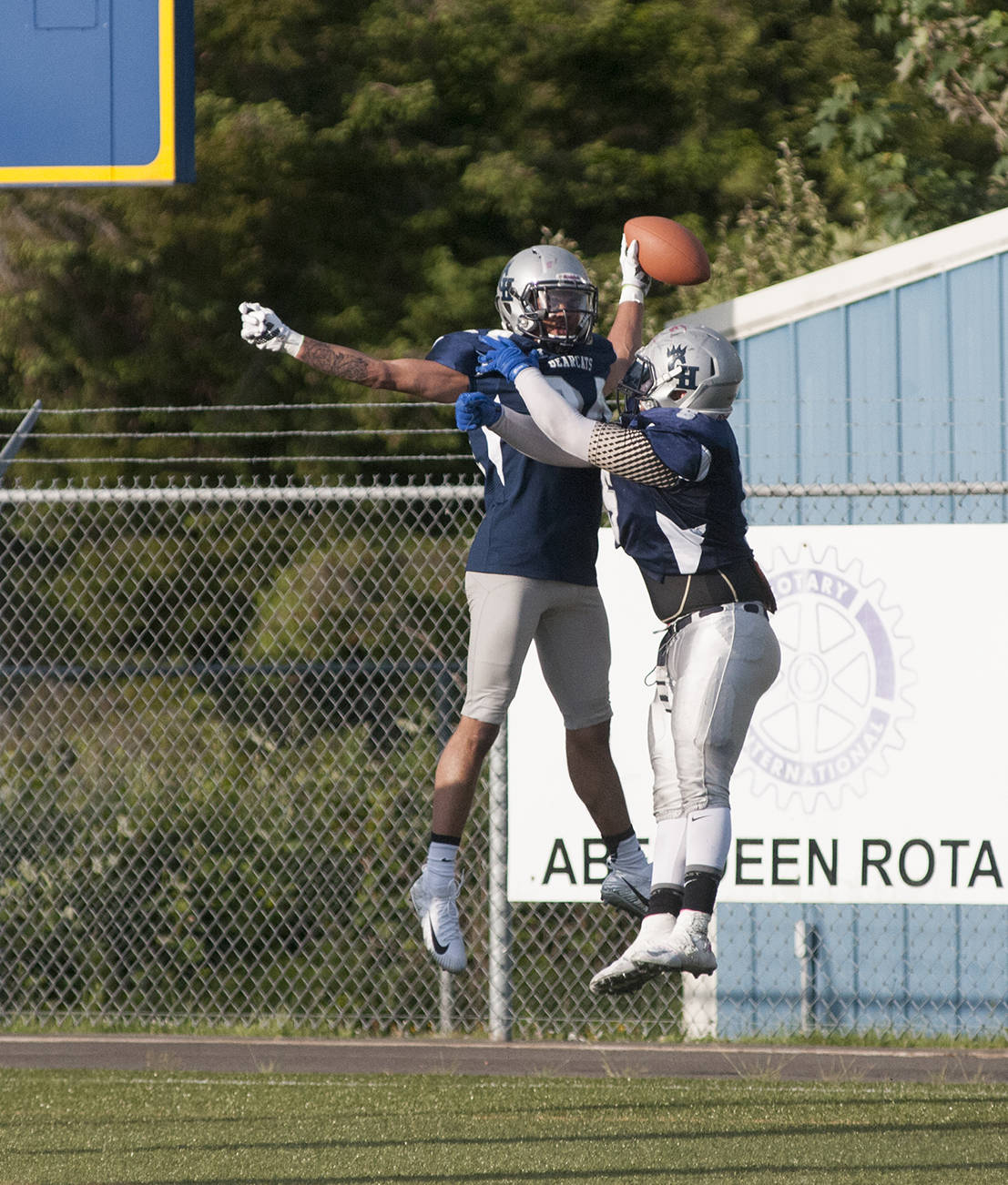 (Brendan Carl | Grays Harbor Newspaper Group) Kareem Johnson, left, and Deeshawn Benjamin celebrate after Johnson picked off a pass for a touchdown on Saturday.