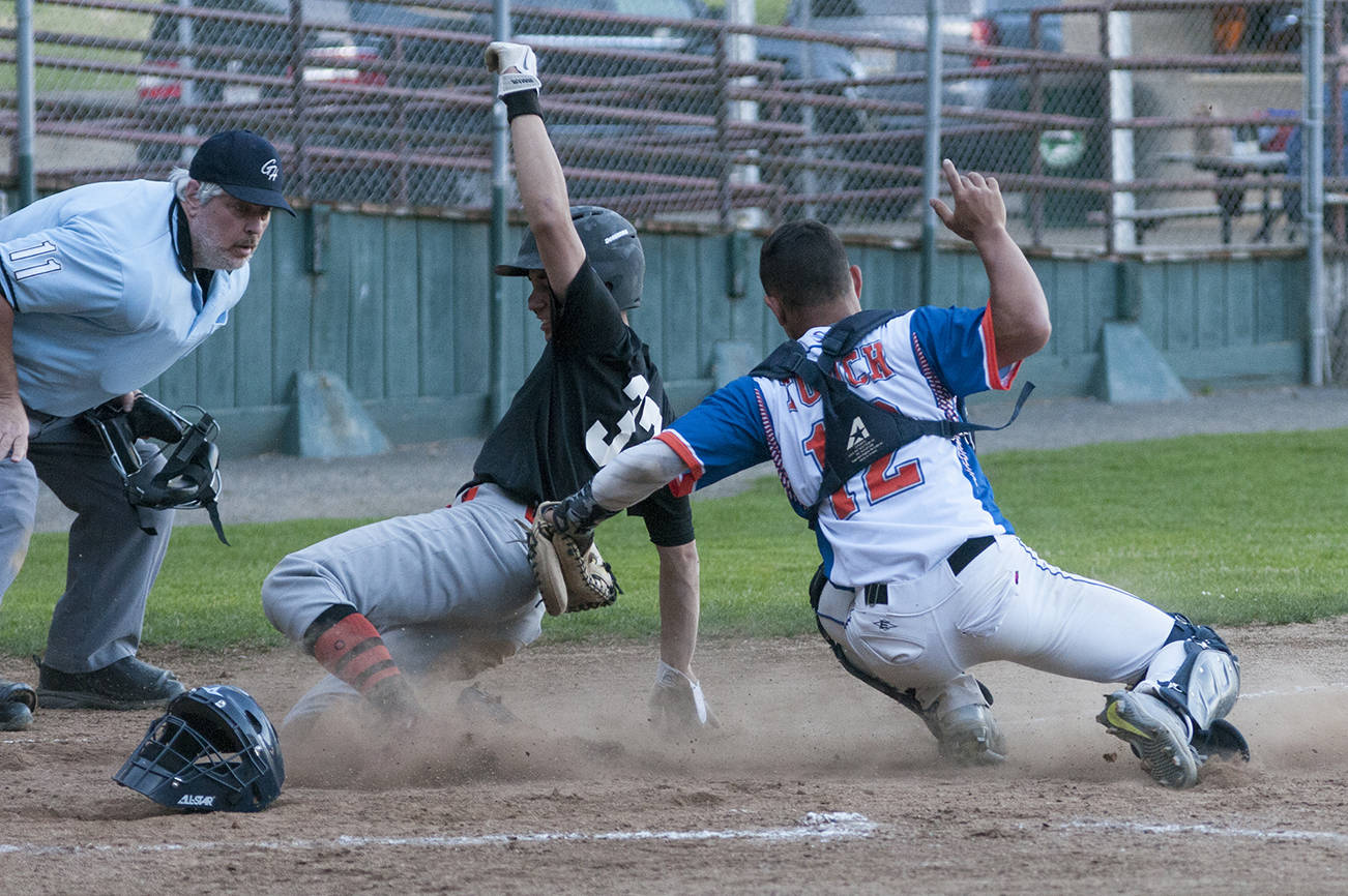(Brendan Carl | Grays Harbor Newspaper Group) R.B.I.s Ty Reece slides under the tag of Grays Harbor’s Kylan Touch during the first game of a doubleheader on Thursday.