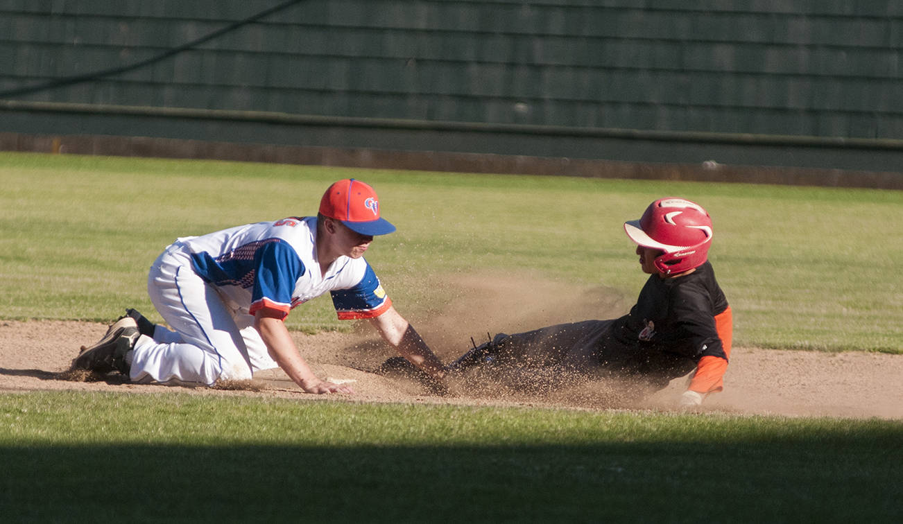 (Brendan Carl | Grays Harbor Newspaper Group) Grays Harbor Longshore Hawks’ Jackson Folkers tags out R.B.I.s Farley Youckton during the first game of a doubleheader on Thursday.