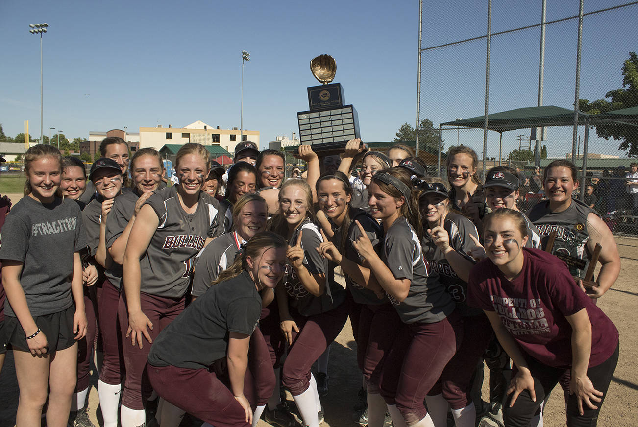(Brendan Carl | Grays Harbor Newspaper Group) Montesano lifts the state 1A softball title after defeating La Center 8-2 on Saturday.