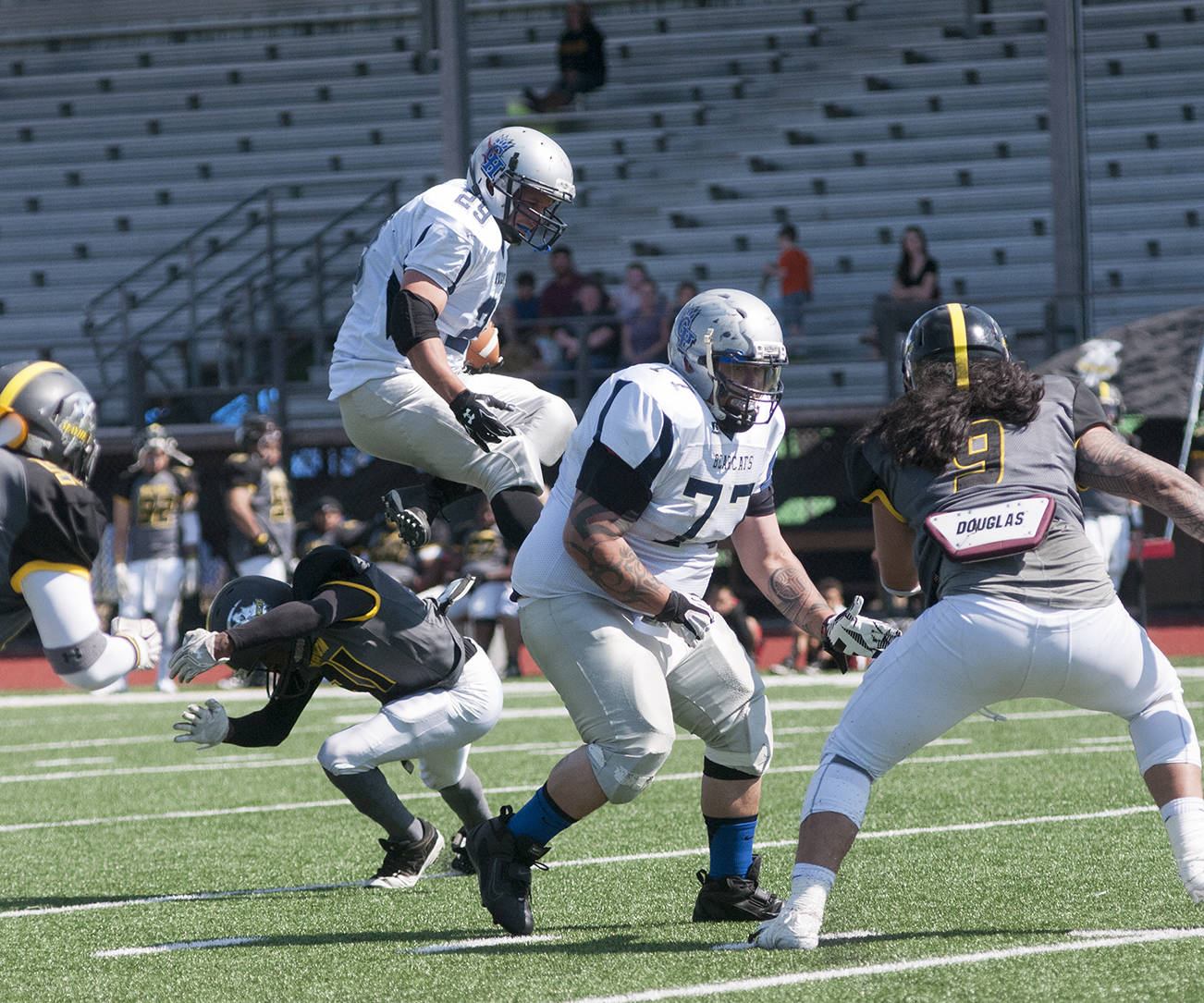 (Brendan Carl | The Daily World) Grays Harbor’s Vincent McCrory goes airborne over a Mayhem defender on Saturday.