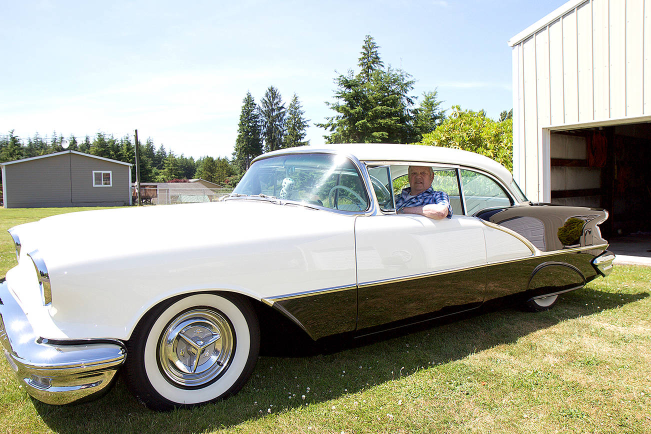 (Travis Rains | The Vidette) Earl Nelson sits in his restored 1956 Oldsmobile Super 88, which will be on hand for the Historic Montesano Car Show July 15.