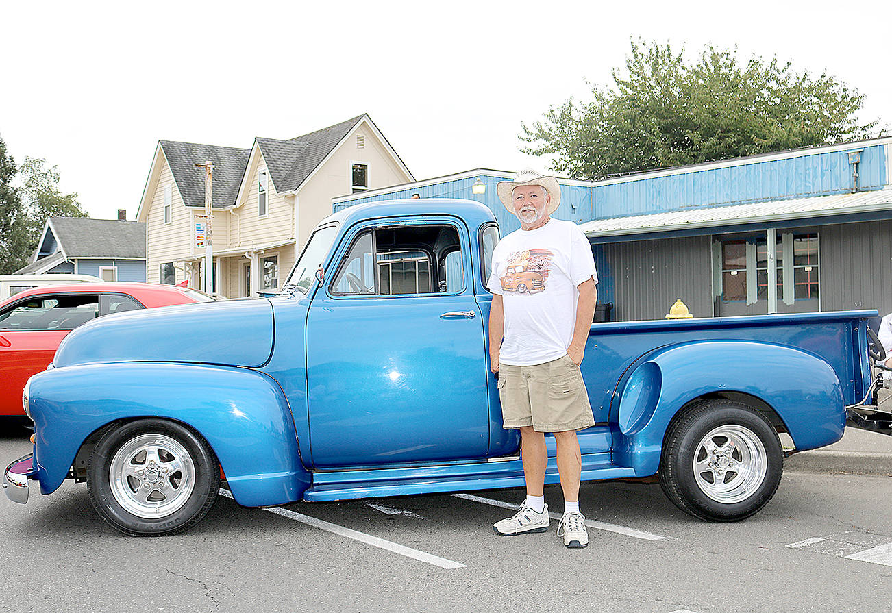 (Travis Rains | The Vidette) Dick Vessey of Elma participated in Heat on the Street for the first time this year and is pictured standing beside his 1953 GMC pickup.
