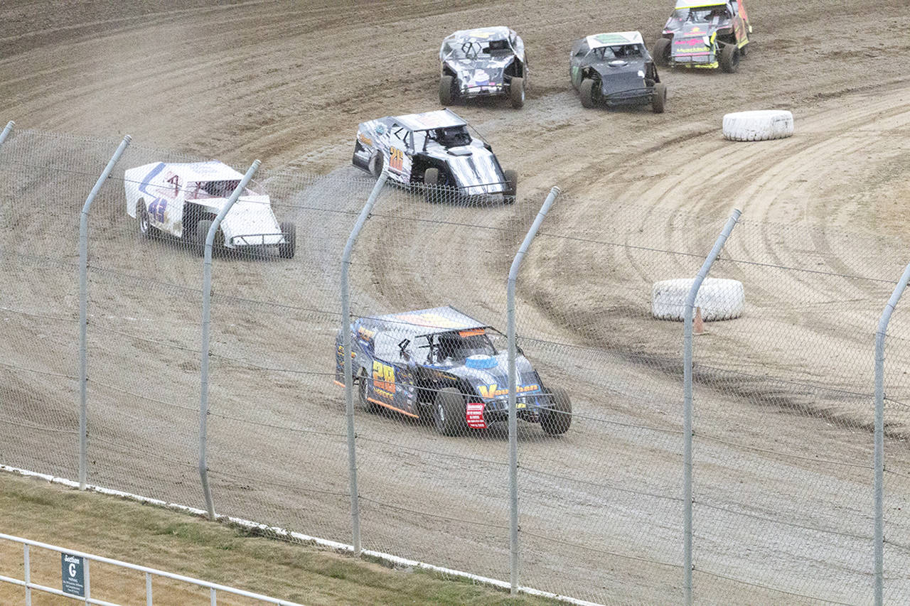 (Corey Morris | The Vidette) Brian Harding of Oakville leads the pack out of turn four during a modifieds heat race on Aug. 12 at Grays Harbor Raceway.