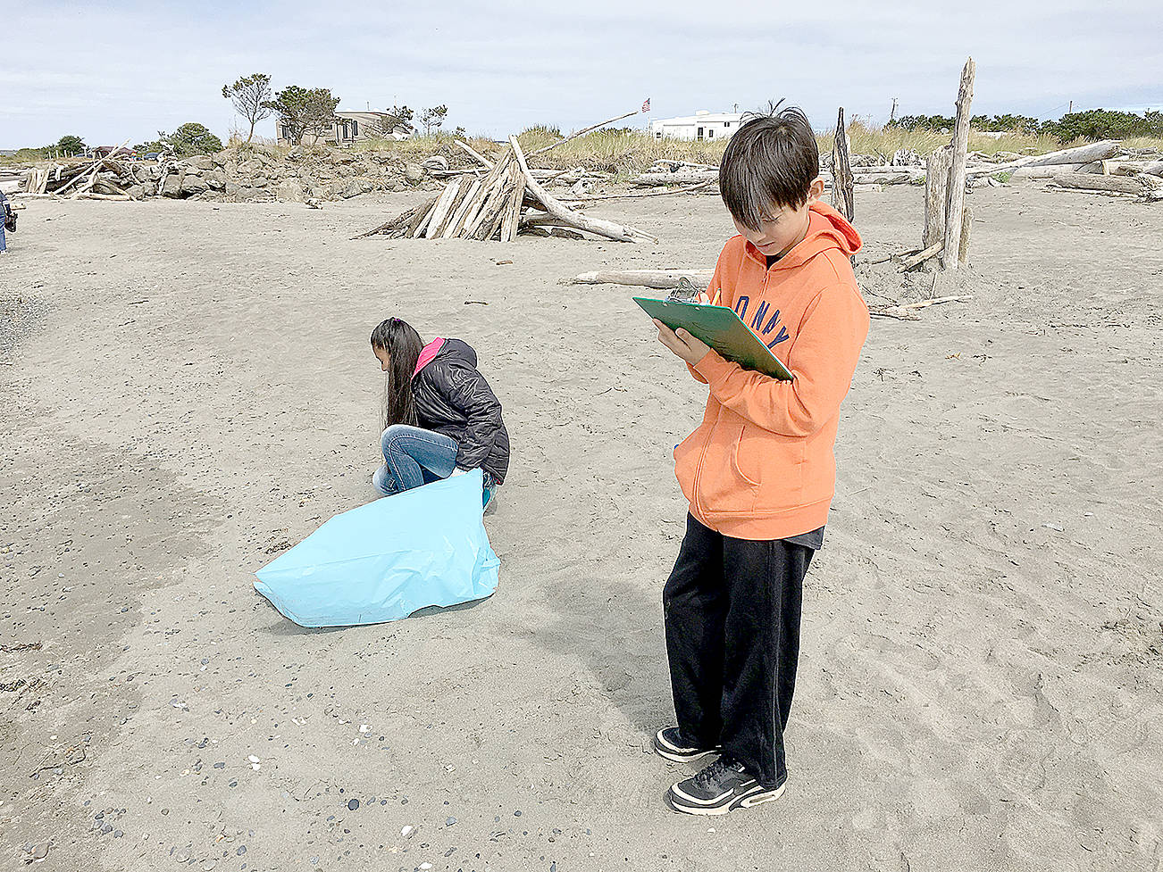 Elma Middle School students clean up debris