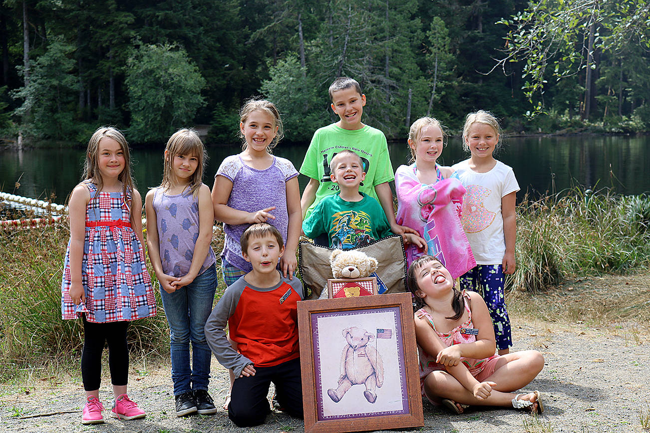 (Travis Rains | The Vidette) Teddy Bear Officers held a picnic Saturday, Aug. 19 to celebrate their hard work in collecting and donating some 2,000 bears to local fire departments and hospitals. From left: Lauren Hudson, Savannah Jolly, Audrey Bradburn, Joan Murphy, Ben Jolly, Mylee Mezzell Riveria Nicholes. Bottom row: Grady Wadsworth, Jerico Jolly and Annabee Wadsworth.