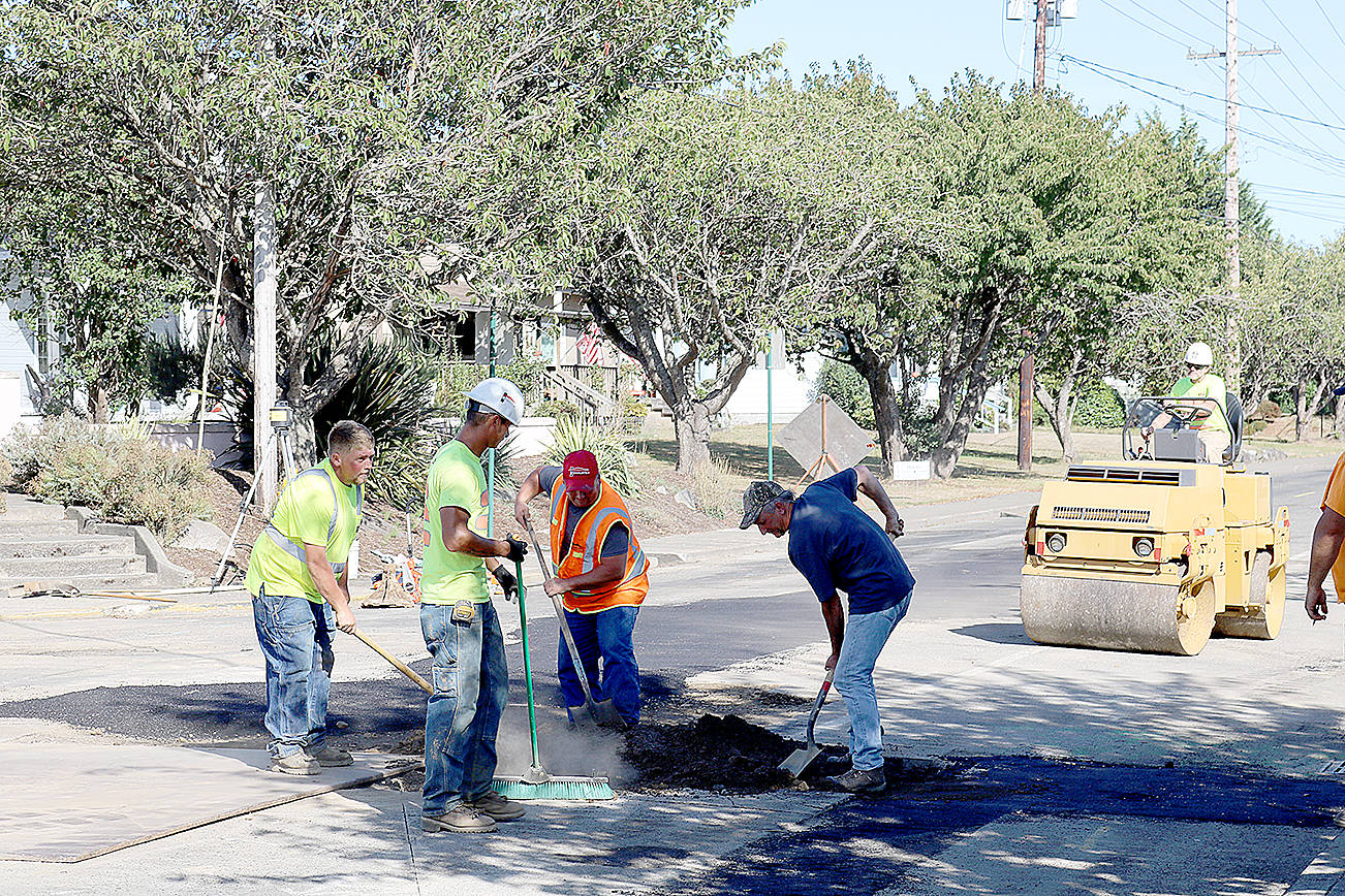 (Travis Rains | The Vidette) A Rognlin’s crew works together to tackle part of the reconstruction effort on East Pioneer Avenue just past the Montesano Fire station on Sept. 11.