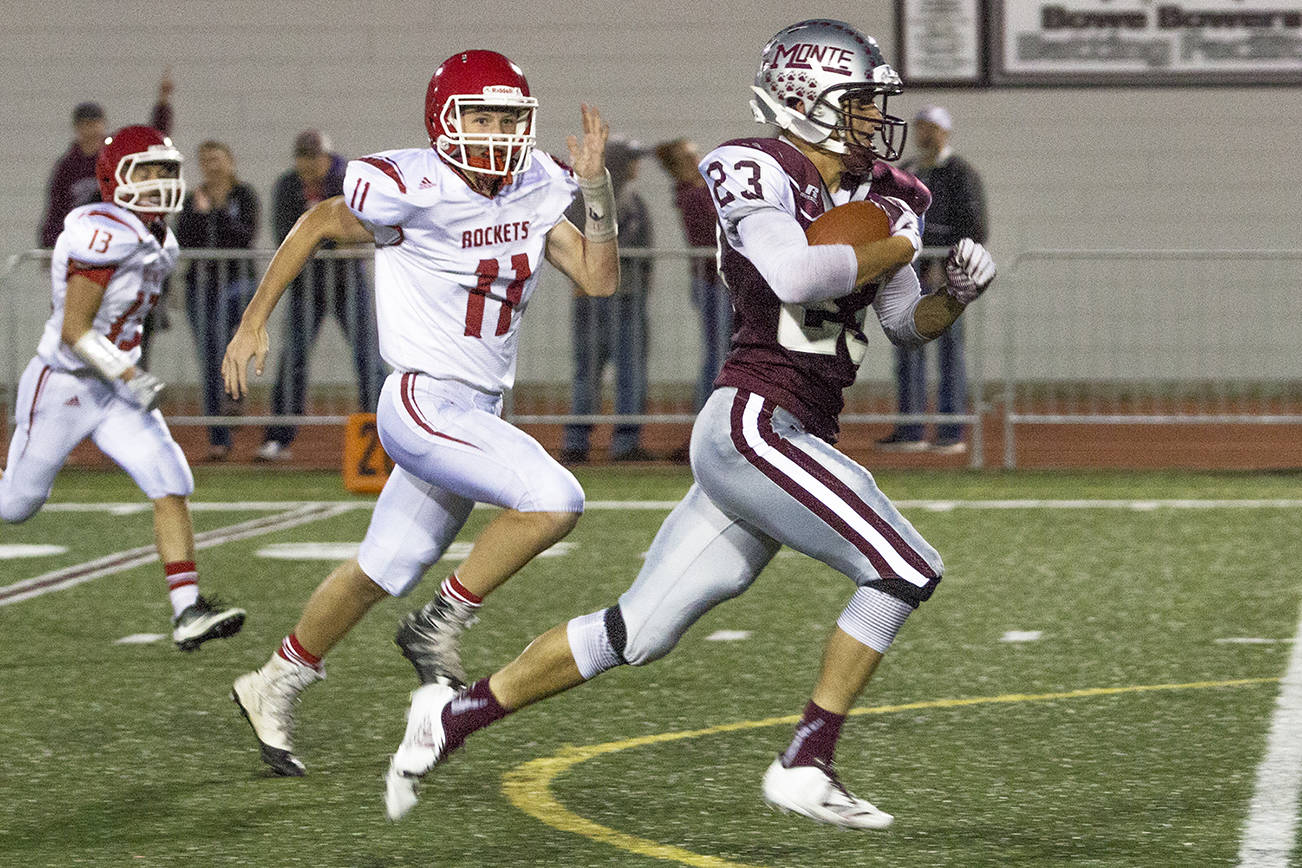 (Photo by Justin Damasiewicz) Montesano’s Kooper Karaffa darts toward the end zone after catching a pass from Trevor Ridgway during a non-league football game against Castle Rock on Friday at Rottle Field.