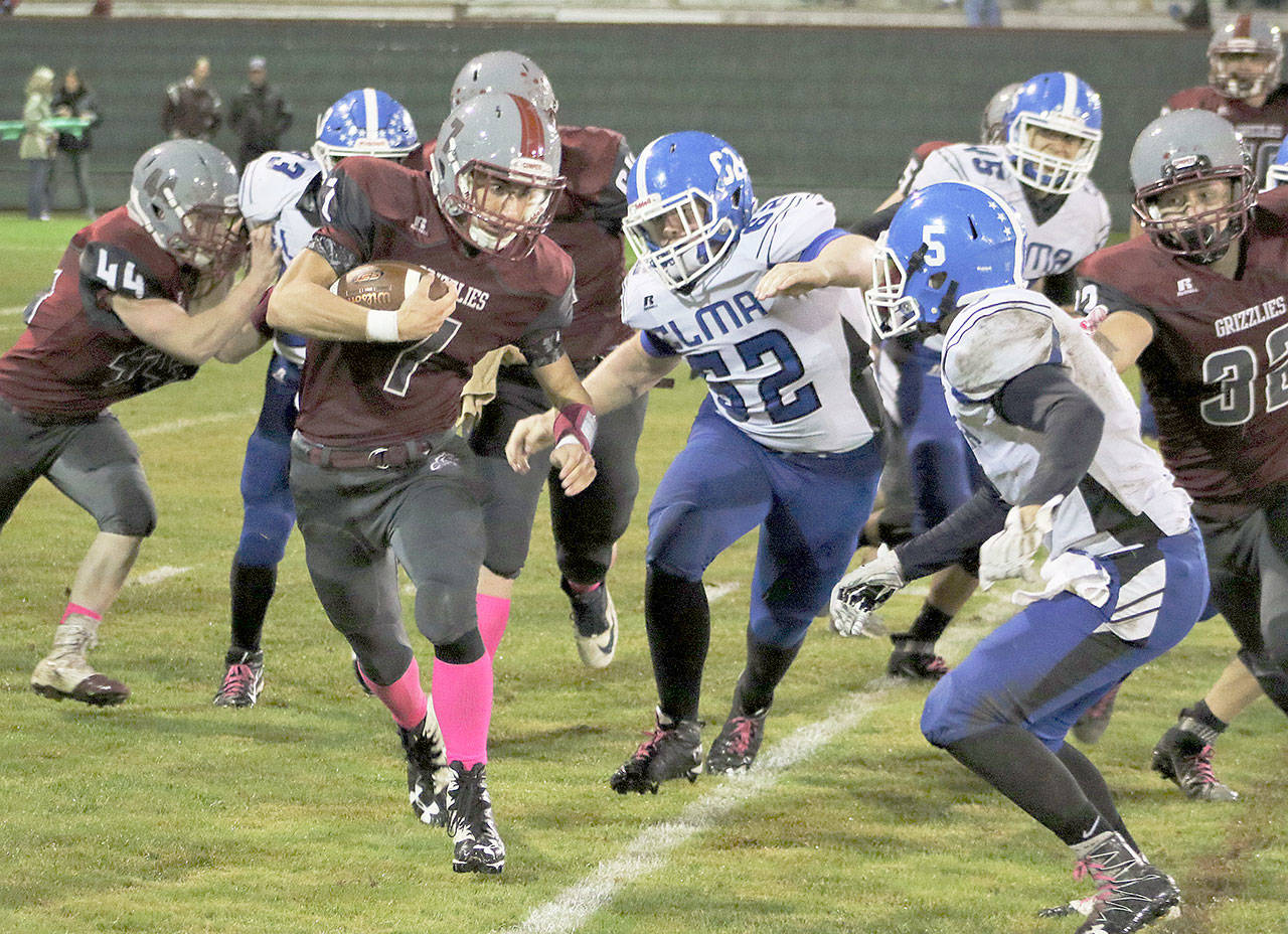 Hoquiam’s Sean McAllister runs the ball during the Grizzlies’ 35-14 victory over Elma on Friday night at Olympic Stadium. (Brendan Carl photography)