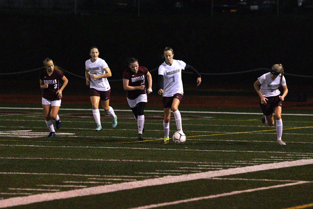 (Corey Morris | The Vidette) Montesano’s Peyton Poler drives forward with a Hoquiam player closing in during a match on Oct. 19.