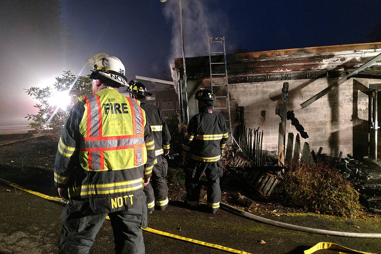 (Courtesy photo) McCleary Fire Chief Paul Nott surveys the damage while crews work to extinguish a fire at the old Mark Reed Hospital building on Oct. 23.