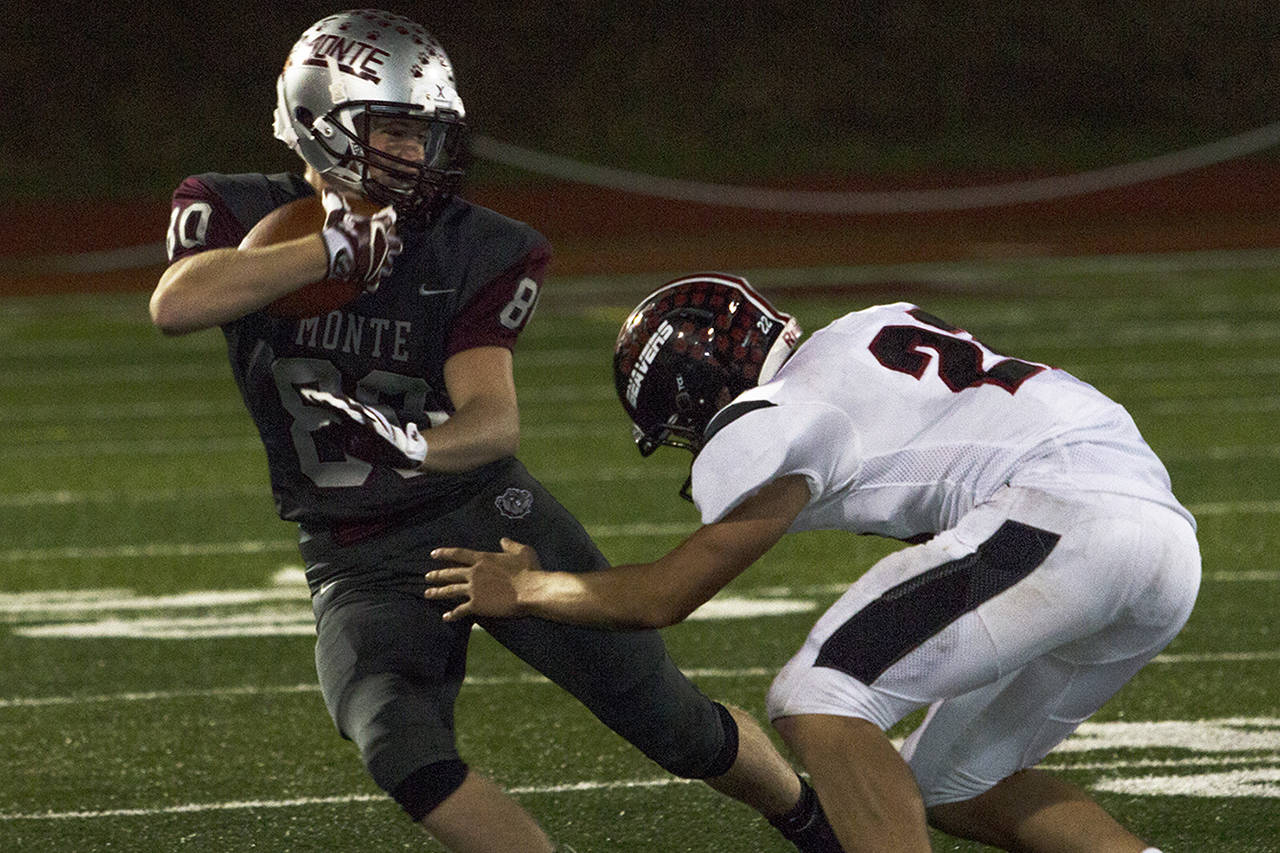 (Photo by Justin Damasiewicz) Montesano’s Kobe Gallinger jukes past a Tenino defender during an Evergreen 1A League football game on Oct. 20 at Jack Rottle Field.