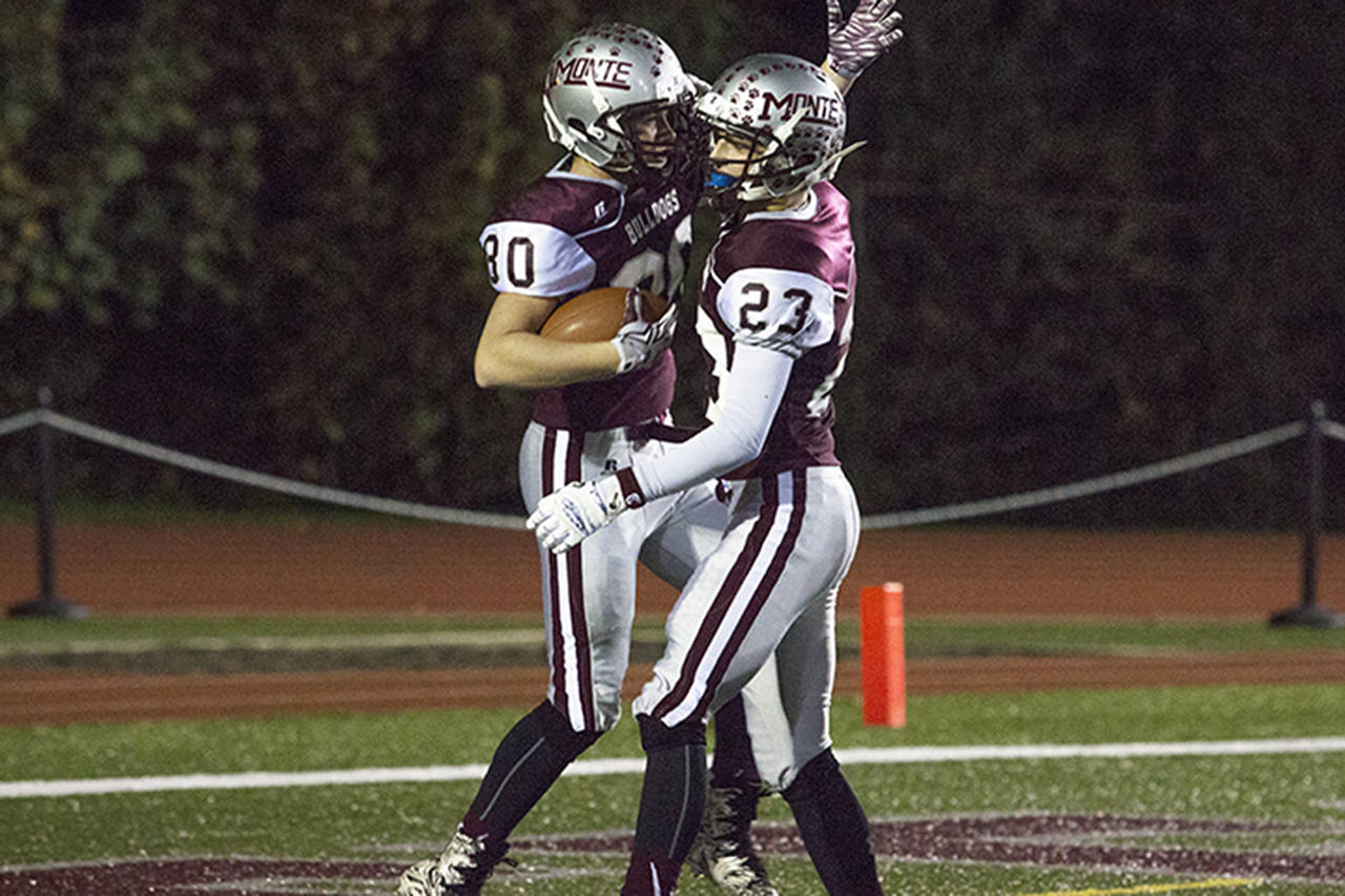 Photo by Justin Damasiewicz                                Montesano’s Kobe Gallinger (left) celebrates with teammate Kooper Karaffa after Gallinger caught a touchdown pass during a District IV crossover football game against Stevenson last Friday at Rottle Field.