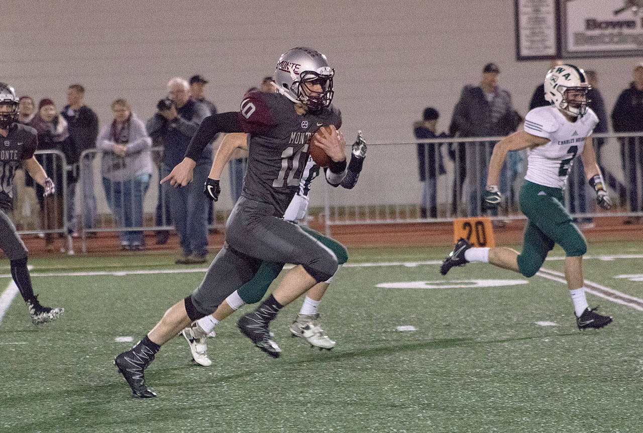 Montesano’s Trevor Ridgway keeps the ball on an option play for a big gain Friday night at Rottle Field. (Brendan Carl Photography)