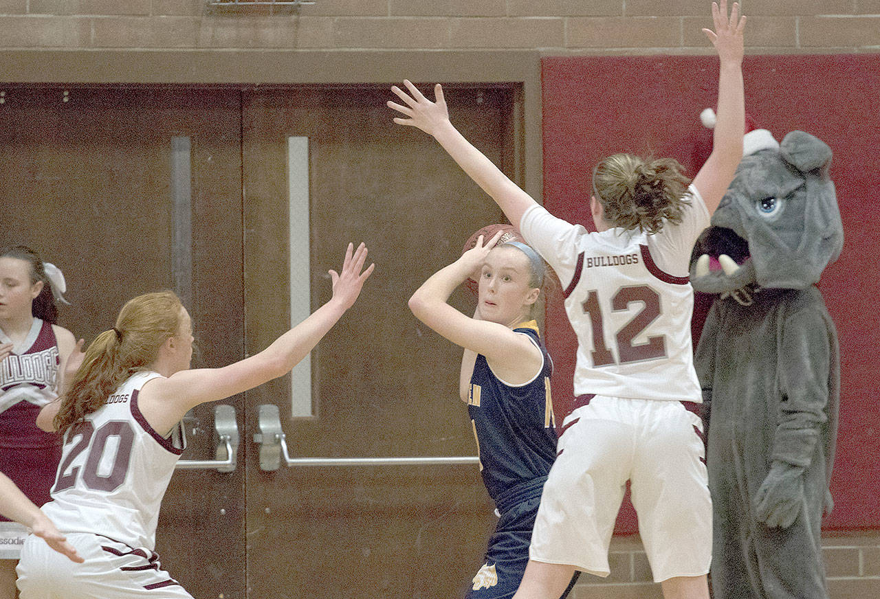 Aberdeen’s Emmy Walsh looks for room to pass between two Montesano defenders Tuesday night. (Brendan Carl Photography)