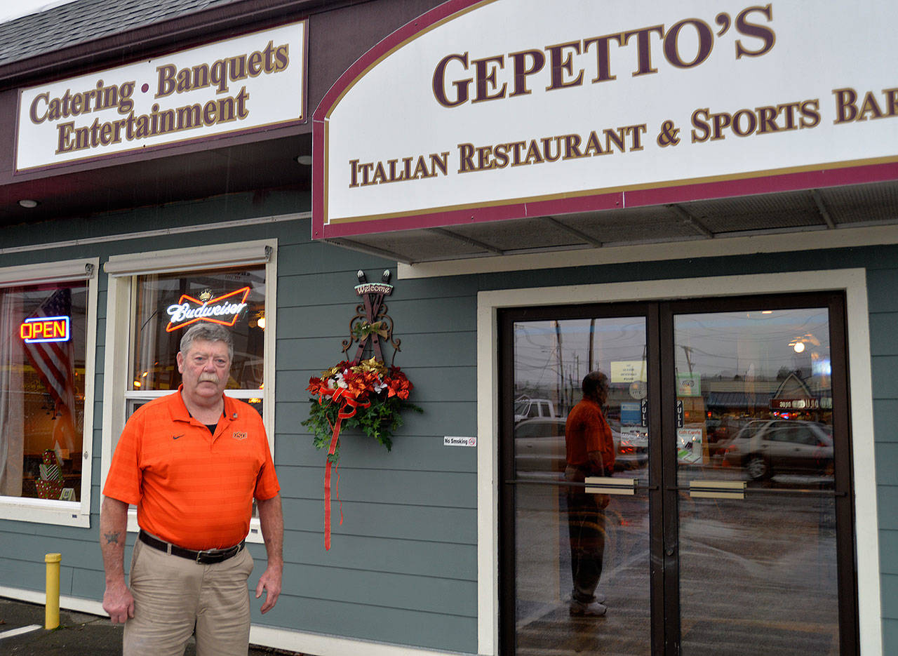 LOUIS KRAUSS | THE DAILY WORLD Gepetto’s owner Bob McEndoo stands outside the Montesano restaurant. He’s concerned about the financial toll a new $11.50 minimum wage will have on business.