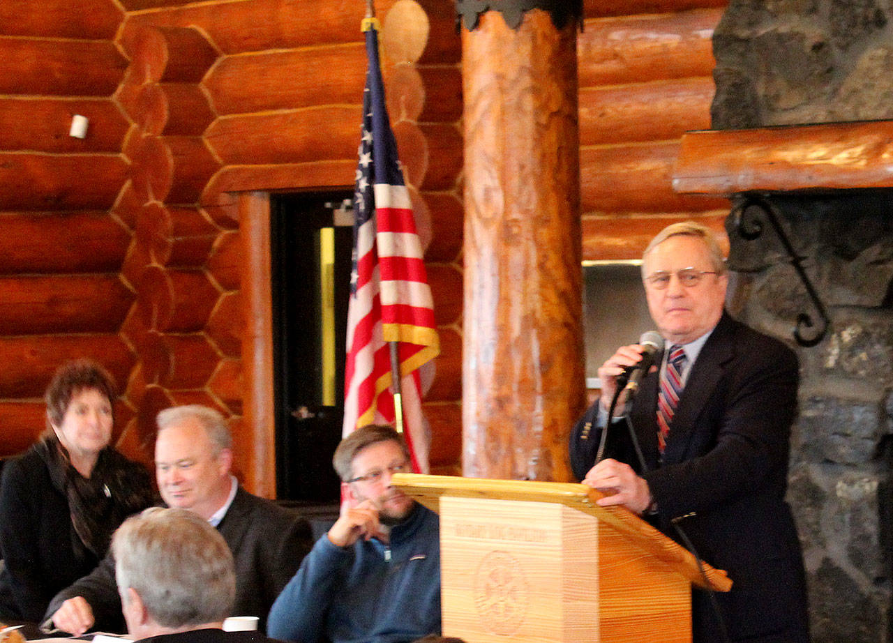 Rep. Steve Tharinger takes the podium while Rep. Mike Chapman and Rep. Jjim Walsh look on at the Aberdeen Rotary Log Pavilion on Friday for the annual Legislative Sendoff sponosred by Greater Grays Harbor Inc.