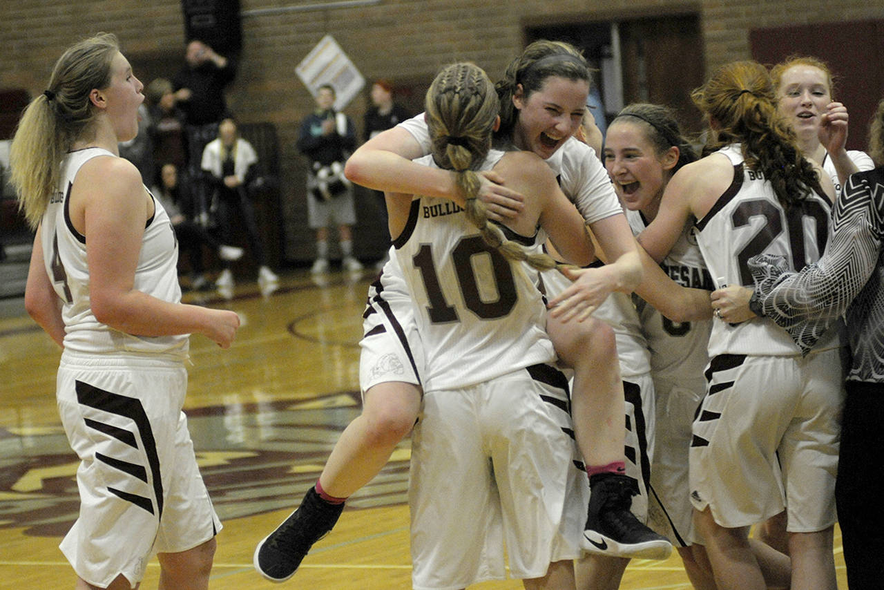 (Hasani Grayson | GH Newspaper Group)                                Montesano celebrates after the final buzzer against Elma on Jan. 9.