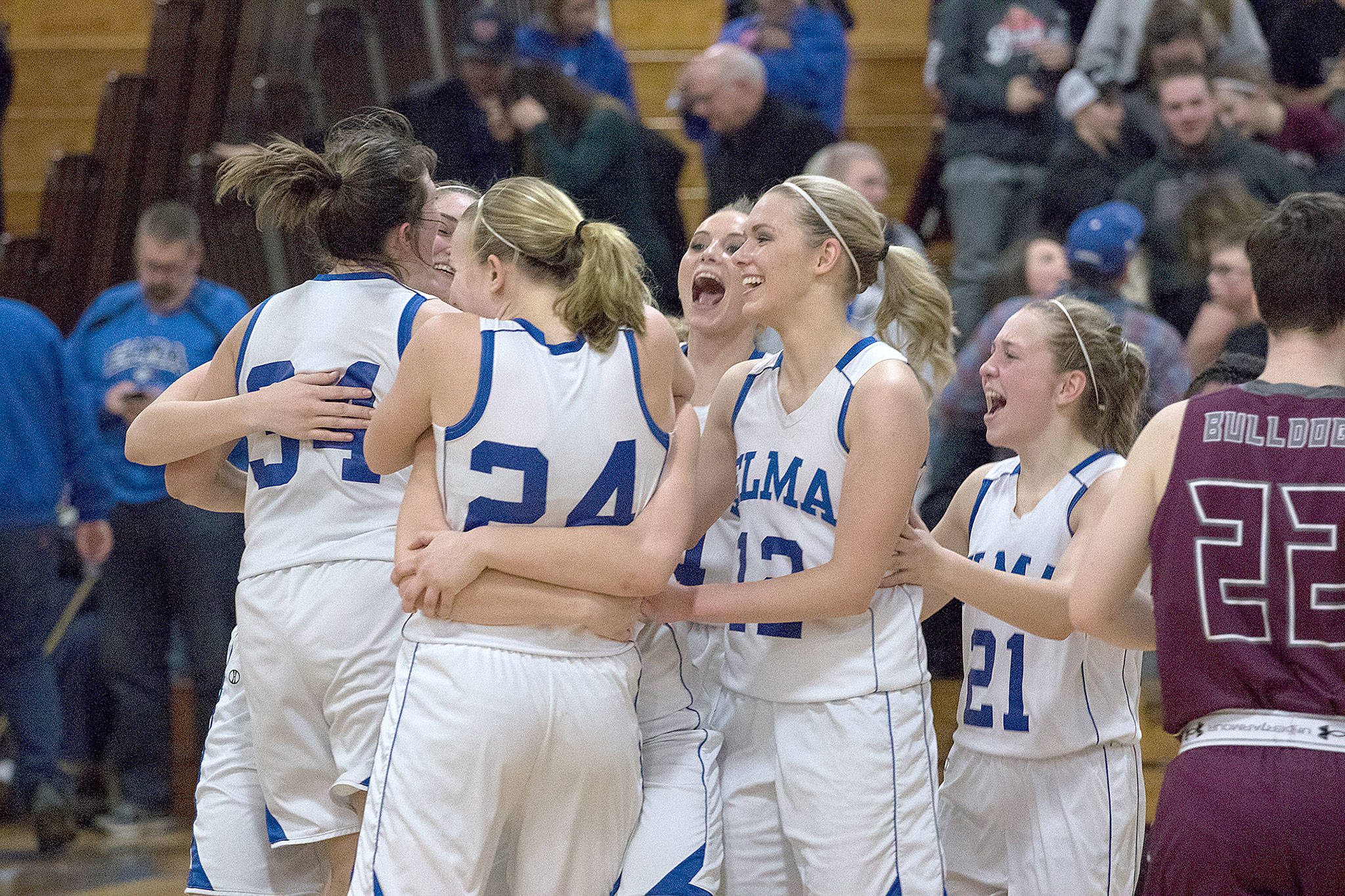Elma players celebrate after defeating Montesano, 60-50, in an Evergreen 1A League contest on Thursday night. With the victory, the Eagles brought Montesano’s 53-game league winning streak to an end. See story and more photos in Sports. (Brendan Carl Photography)