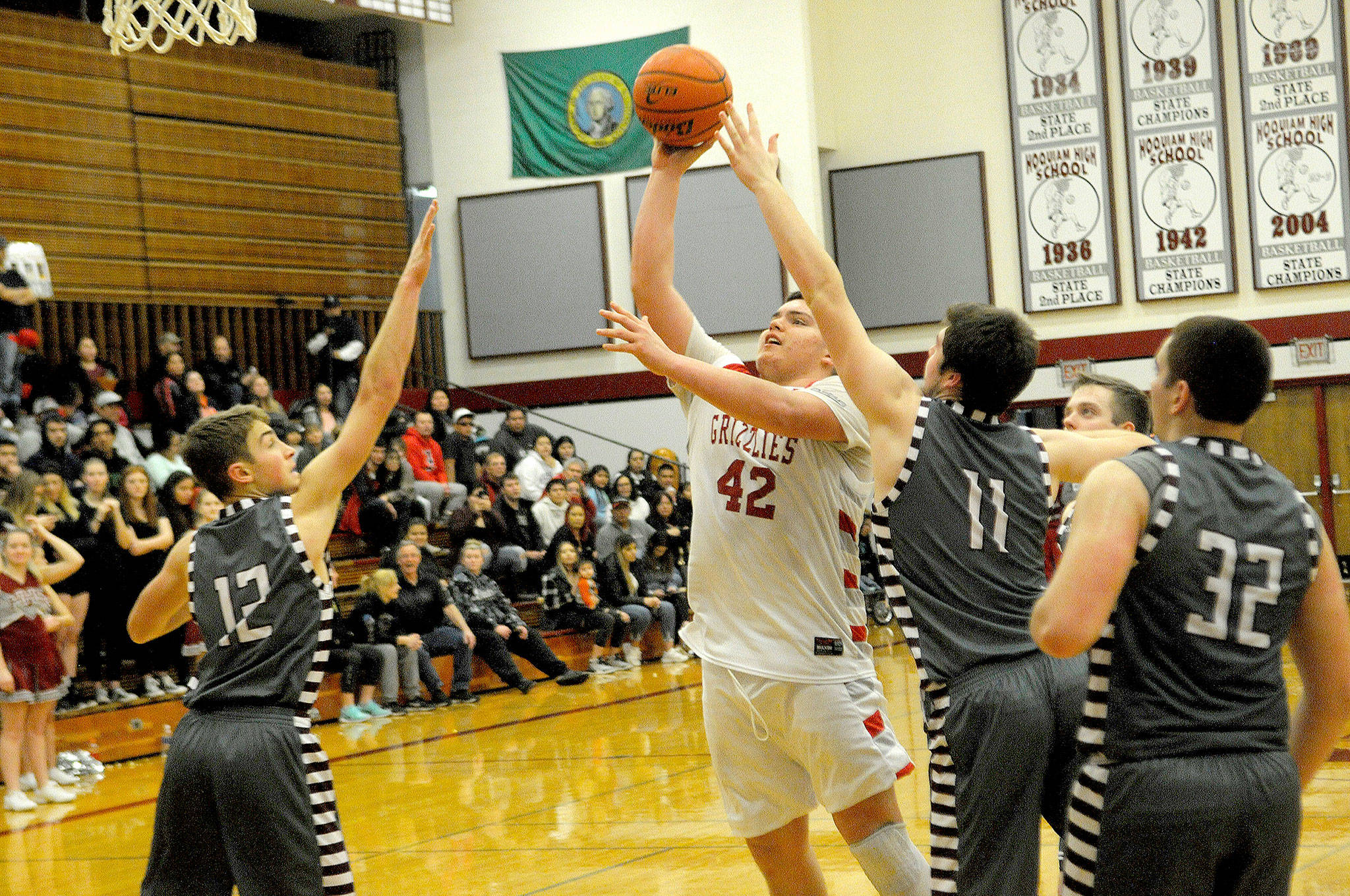 Hoquiam’s Matt Brown puts up a shot between several Montesano defenders Thursday night at Hoquiam Square Garden. (Hasani Grayson | The Daily World)