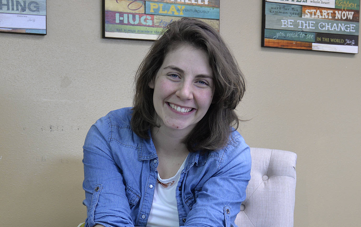 DAN HAMMOCK | THE DAILY WORLD                                Beyond Survival executive director Maddie Graves-Wilson sits in the building behind the existing headquarters at 120 W. Wishkah, recently purchased by the group to provide more space for care of women, children and men who have been victimized by sexual abuse.