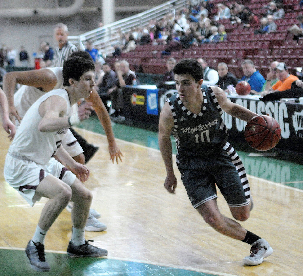 Trevor Ridgway drives toward the paint in the first half against Northwest at the 1A State Tournament. Ridgway finished with eight points. (Hasani Grayson | The Daily World)