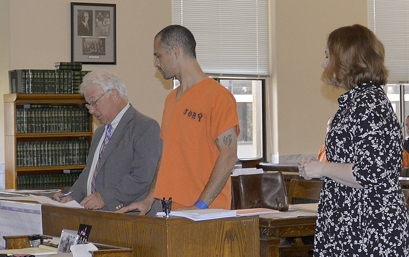 DAN HAMMOCK | THE DAILY WORLD                                Isaac J. Gusman pleaded not guilty in Grays Harbor County Superior Court on Monday to two felony charges relating to an attempted kidnapping in Montesano on May 16. At left is defense lawyer David Arcuri. At right is county Prosecutor Katie Svoboda.