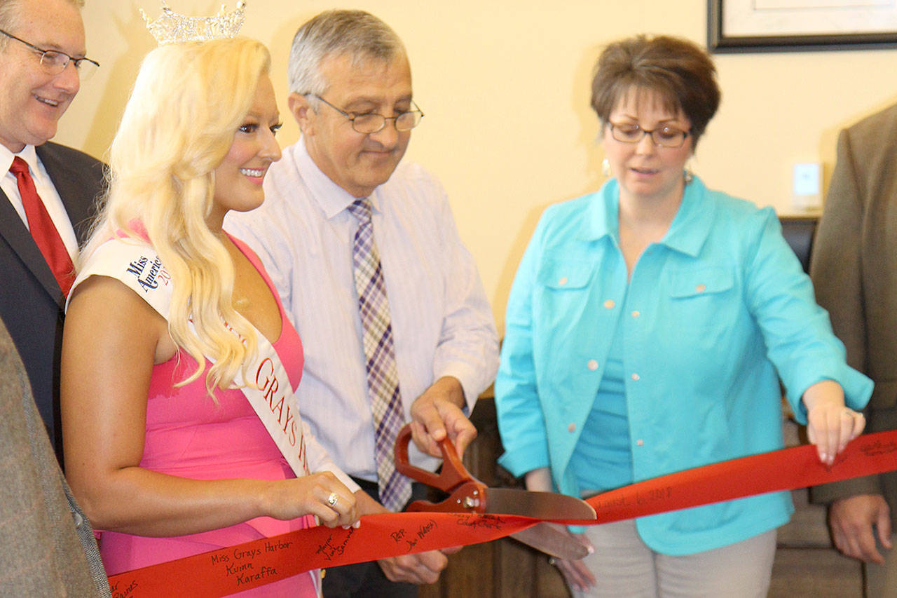 County Director of Utilities and Facilities Mark Cox, from left, Miss Greys Harbor Kuinn Karaffa, Judge David Edwards and County Councilwoman Vickie Raines attend the ribbon-cutting ceremony Monday, Aug. 6, for the new Superior Court courtroom at the County Courthouse in Montesano.