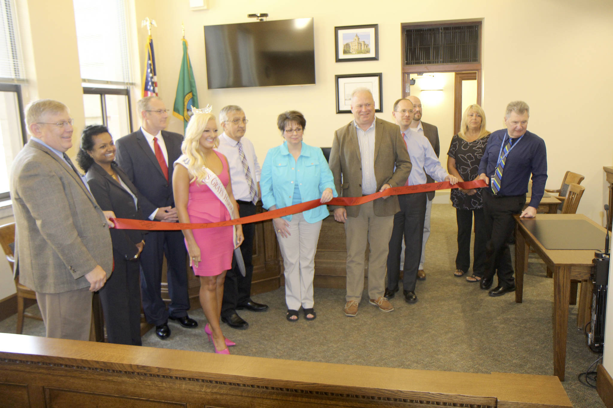 A lineup of county dignitaries attends the opening ceremony Monday, Aug. 6, of the new Superior Court courtroom at the County Courthouse in Montesano.