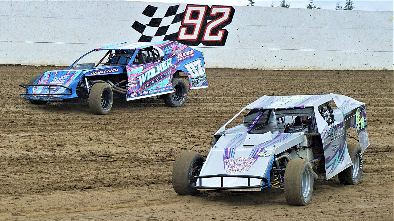 Tyler Walker (87) and Bill Rowe race side-by-side during a Shipwreck Beads Modifieds race at Grays Harbor Raceway on Saturday. (Photo by AR Racing Videos)